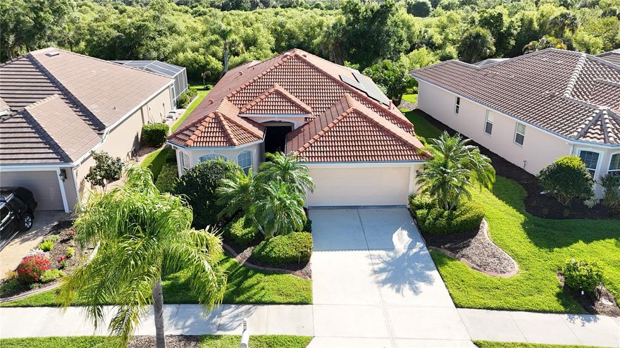 * PLEASE TAKE A WALK THROUGH YOUR NEW HOME WITH A 3D INTERACTIVE VIRTUAL TOUR! * NOW is the time to start living the resort lifestyle you’ve always dreamed about. Welcome to your beautifully UPDATED 3-bedroom, 2-bathroom, 2-car garage home in the prestigious Heron Creek Golf & Country Club—featuring PAID-OFF 3.5 kw solar panels for added energy efficiency and long-term savings! As you approach this extraordinary residence, you’re greeted by lush tropical landscaping that surrounds the home, creating a captivating first impression. Recent upgrades include NEW: interior paint, ceiling fans, light fixtures, cabinet hardware, faucets, switch plates, vent covers, and flooring —the sellers truly left nothing to spare. Step inside to an inviting foyer and expansive Great Room, highlighted by arched entryways, high ceilings, built-ins, and abundant natural light. Triple sliding glass doors allow for seamless indoor-outdoor living, letting those cool Florida breezes flow effortlessly through the home. The gourmet kitchen offers an abundance of cabinet and counter space, a closet pantry, plant shelves, brand-NEW stainless-steel appliances (including a GAS stove), breakfast bar, and a charming eat-in area with an aquarium window—perfect for entertaining. The exquisite primary suite is a true retreat, privately situated in its own wing with space for a king-sized bed and sitting area. Enjoy direct lanai access, a custom walk-in closet, and an abundance of natural light. The en-suite bath features dual vanities, a private water closet, Roman shower with built-in bench, and a relaxing garden tub. This thoughtfully designed split floor plan is ideal for guests. Two additional bedrooms are located at the front of the home, both light and bright, with new carpet. Bedroom #2 includes a built-in dresser perfect for a vanity setup, while Bedroom #3 features three large windows. A full guest bath with solid surface counters completes the space. Step outside to your private backyard oasis—the epitome of Florida living. The OVERSIZED SCREENED LANAI is perfect for grilling, entertaining, sunbathing, or simply relaxing. With ample space to add a hot tub or outdoor kitchen, the possibilities are endless. Heron Creek Golf & Country Club offers a warm, vibrant community lifestyle centered around a 27-hole championship golf course designed by Arthur Hills, featuring the Oaks, Marsh, and Creek courses. Residents enjoy a 21,000 sq ft clubhouse, resort-style pool and spa, lighted Har-Tru tennis courts, a fitness center, and exceptional dining. Conveniently located near I-75, you’re just minutes from shopping, dining, North Port Aquatic Center, Centennial Park, Wellen Park, Braves Stadium, and the Gulf beaches. HOA fees include ground maintenance, irrigation, cable, high-speed internet, and guarded gate entry. Hurry—Nothing Compares. The only thing this home is missing is you. Come for a visit… stay for a lifetime. Schedule your showing and make your offer today!
