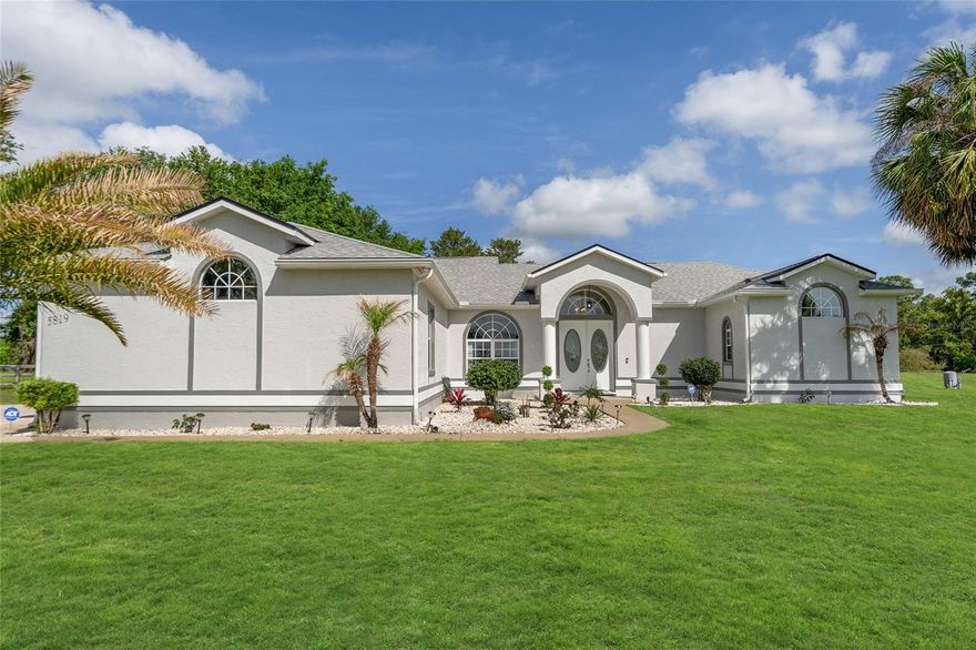 Welcome to your own private oasis! This beautifully maintained 3-bedroom, 3-bath home sits on a generous 1.73-acre lot, offering space, comfort, and style both inside and out.
Step inside to discover a bright and inviting open floor plan featuring soaring 10 to 14-foot ceilings, elegant marble flooring, and architectural touches like rounded corners and plant shelves. The formal living room and large family room provide ample space for relaxing or entertaining, while pocket sliding doors seamlessly connect indoor and outdoor living, opening to a stunning screened-in pool area perfect for Florida living.
The chef's kitchen is both functional and beautiful, boasting a large center island with storage, corner sink with a picturesque view of the pool and backyard, built-in desk and planning station, pantry, and a breakfast bar. The adjacent family room area includes French doors leading to the pool for effortless entertaining.
Retreat to the spacious master suite featuring private pool access, his and hers walk-in closets, and a luxurious en-suite bath with dual sinks, a soaking tub, and an oversized walk-in shower.
Guests will enjoy a large bedroom with direct access to a full guest bath, providing comfort and privacy. Additional highlights include a front coat closet, a solar tube for natural lighting, two new AC units (2017), and a new roof (2022).
With plenty of room to roam, a gorgeous pool setting, and thoughtful design throughout, this home offers the perfect blend of  tranquility and everyday luxury. Don?t miss the opportunity to make it yours!