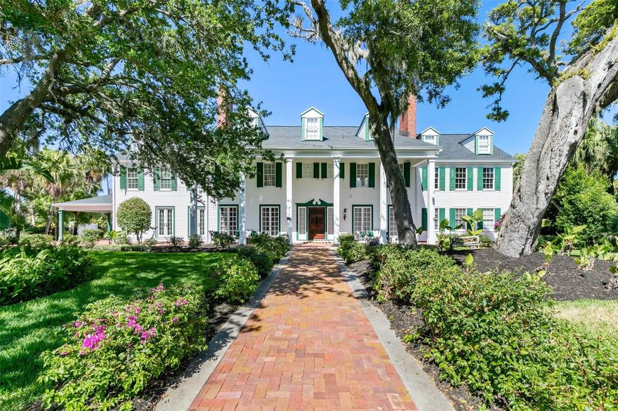 Behold the stately residence, Rowallan. Built in 1913 on 1.63 acres of lush gardens, it sits across from the Intercoastal Waterway, just a short walk to the Atlantic Ocean. The home has been carefully and lovingly cared for through the years, maintaining the integrity of the original design and construction. The interior has been updated to today's luxury standards and creature comforts, painstakingly coordinating with the unique design of that era. You will appreciate the beauty of five original fireplaces, the 6 spacious bedrooms, 6 vintage baths and 2 half baths. An impressive double door entry opens to a foyer with a grand, double staircase. You'll travel back in time, enveloped in beautifully detailed crown molding, wainscoting, carved fireplaces and the grandeur that is Rowallan.

Among the many unique features of this coveted historic estate, which is on the National Historic Registry, are the preserved wall murals by the famed artist, Jay Postle, and the original heart pine wood floors in the parlor, library, formal dining room, and downstairs bedroom. The upstairs primary suite is an expansive, comfortable retreat, (54 x 17) boasting two sitting areas, 2 fireplaces, a changing room and an oversized, fully customized, walk-in closet. The en suite features a vintage design, representative of the era, in a beautiful black and white marble palette. The remaining 5 bedroom suites are spacious and welcoming, each with a coordinating vintage bath. On the 3rd floor is a 1,750 sq. ft. finished & air conditioned attic with a half bath, which could be used as a game room, theater, or gym. The original kitchen has been remodeled - updated with modern appliances and finishes. The Butler's Pantry provides additional storage space with additional food preparation work space for large parties. A casual kitchen dining area, or morning room, provides expansive views of the gardens, patios, pool & spa, cabana, and the lush, gated grounds. 

A large lanai offers shaded outdoor entertainment space, with a fireplace and wet bar. The cabana is inviting with a kitchenette and bath which could be used as a private guest house or mother-in-law suite, and has access to the open air pool and spa. The pool features a large deck, perfect for holding large gatherings of family and friends. Access to this coveted private estate is through two gated entryways on John Anderson Drive or through private gated entrance on Landmark Circle. 

The residence is centrally located near downtown Ormond dining and shopping, riverfront parks, the prestigious Oceanside Country Club, and a just a short walk to the Atlantic Ocean. This one-of-a kind, historic estate offers a lifestyle reminiscent of a bygone era, of laughter and joy, abundance, and gracious living. Don't miss this rare opportunity to own a historic masterpiece. Once you view it, you'll want to make it your own!

All information is intended to be correct but is not warranted. Buyer should exercise due diligence. All buyers are encouraged conduct a home inspection before purchasing a home.