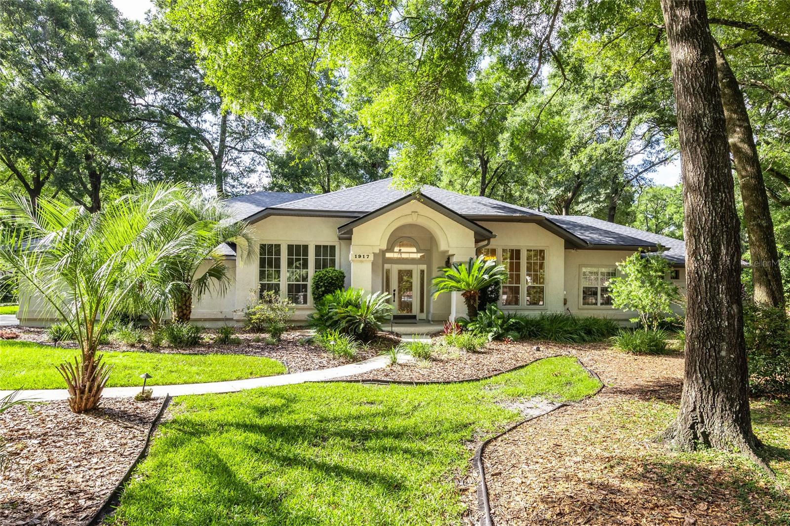 **POOL HOME** Welcome to this stunning POOL HOME nestled on a private, half-acre corner lot in one of Gainesville’s most desirable neighborhoods, Avalon. This thoughtfully designed 5-bedroom, 3-bathroom home features a split floor plan, two spacious living areas, a formal dining room, and a cozy fireplace for added warmth and charm. The heart of the home is the open concept kitchen that over looks the beautiful pool, alluring granite countertops, stainless steel appliances, and elegant glass-pane cabinets. Enjoy meals in the breakfast nook or entertain effortlessly indoors and out. Step into the oversized owner’s suite, complete with a luxurious California-style walk-in closet, dual vanities, a relaxing soaker tub, and a walk-in shower. The remaining bedrooms are generously sized, offering space for family or guests. Out back, you'll find your private oasis! Enjoy the Florida weather year round with a fully screened-in pool with ample patio space, an outdoor bar, and multiple sitting areas perfect for entertaining, intimate dinners, or your morning coffee. Conveniently located just minutes from grocery stores, restaurants, the University of Florida, Shands Hospital, North Florida Hospital, the VA Hospital, and easy access to I-75 this home truly has it all. Don’t miss the opportunity to live, relax, and entertain in style. (Roof: 2025). (Water Heater: 2023) Call for your private showing today!