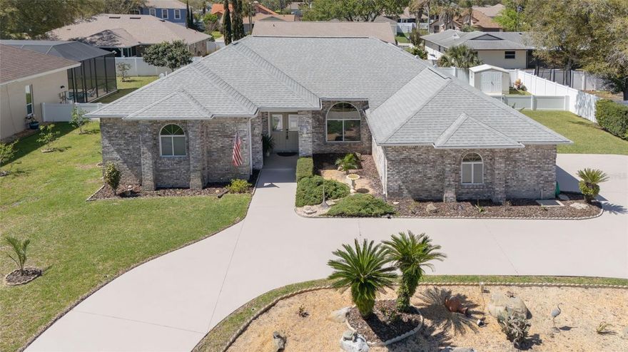 Desirable Pine Lakes brick home built by Cliff Parlow with a saltwater pool, spa and waterfall, showcasing exceptional pride of ownership. Set on an over sized lot with mature landscaping and a circular driveway, this property offers both curb appeal and functionality. The fenced backyard provides added privacy, perfect for relaxing poolside on warm summer days and features a convenient open-air shower; ideal after a swim, time spent in the yard or grilling by the pool. Inside the floorplan offers three bedrooms complimented by a beautifully updated kitchen with granite countertops, breakfast bar, stainless steel appliances, appliance closet, eat-in kitchen area with mitered windows overlooking the pool. Large master bathroom with a 4x7 tiled step down shower, oversized jetted garden tub and solid surface countertops. This is a must see home!