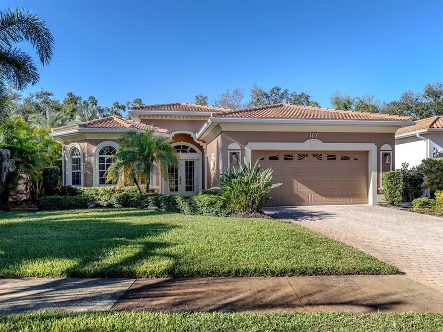 Experience relaxed coastal living in Bellagio on Venice Island, a sought-after gated community bordering the Intracoastal Waterway and moments from pristine beaches and the charming shops and restaurants of downtown Venice. This three-bedroom, two-bath residence welcomes you with a grand foyer accented by a custom tile inset leading into a bright, open layout designed for effortless entertaining. The open living and dining area extends through glass sliders to a screened lanai framed by vibrant tropical landscaping, perfect for relaxing or entertaining. The kitchen features white cabinetry, granite countertops, a generous pantry, and an inviting breakfast area. The primary suite serves as a serene retreat with dual walk-in closets and a spa-inspired bath offering separate vanities, a jacuzzi tub, and a glass-enclosed shower. Two guest bedrooms provide flexibility for family, visitors, or a home office. Additional highlights include hurricane protection for peace of mind, a natural gas water heater, natural gas stove and dryer, and a meticulously maintained garage with ample storage. Other major updates include new tile roof 2023 with 10 year warranty, new A/C 2020.  With the clubhouse just steps away you'll enjoy an active social lifestyle with a clubhouse, pool, and tennis courts, while the Legacy Trail just beyond the gates offers scenic access to the Intracoastal Waterway and downtown.
