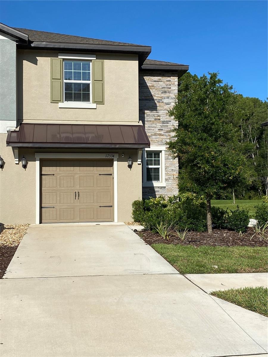Looking for nature close to the city? Look no further! This two-story end-unit Townhouse in Angeline Subdivision, 6,200+ acre master-planned community where “Innovation, Nature and Health Live” is ready for you! With a covered patio and serene backyard water view it offers daily privacy and tranquility. Build in 2023 it reflects modern vibe. It boasts a practical layout, featuring a specious living/family room combo, with white cabinets, stainless steel appliances, granite countertops kitchen, dining room, and a half bathroom on the first floor, perfect for entertaining guests or enjoying quality time with family. The tile floors provide easy-to -maintain surface throughout all ground floors. The second floor features a loft area ideal for play space, home office, or additional seating room. The owners’ suite has a walk-in closet and attached en-suite bathroom. Two additional bedrooms, Jack-n-Jill bathroom and a laundry room are also upstairs. With 3,600 acres of green space, 100 miles of trails and pathways this subdivision offers a wealth of outdoor activities, adventures and delight. On-site Angeline Academy of Innovation STEM (Science, Technology, Engineering, and Math) Middle and High Schools provides lates and greatest in school's curriculum. Close by Moffit’s Global Innovation Center will be one of the largest hubs for high-tech research and world-class medical facilities in the country. A sustainable, professionally managed farm delivers not only local produce but also educational and family-friendly events. This move-in ready house in a quiet neighborhood represents a great opportunity to lease piece of real estate in a prime location. Don’t miss this chance, schedule your private showing today.