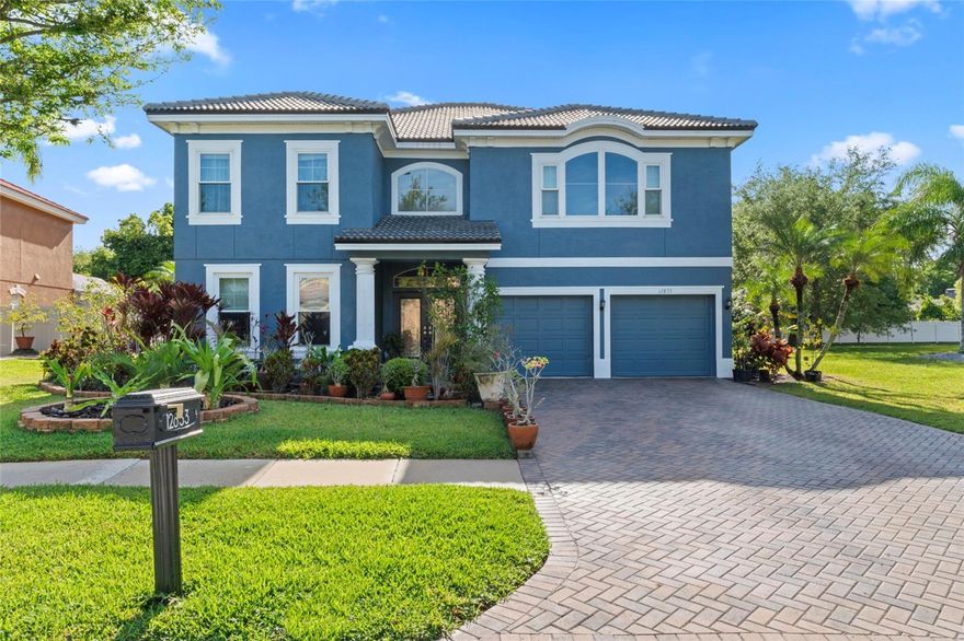 NOT IN A FLOOD ZONE...NEW $70,000 TILE ROOF (2024), FULLY UPDATED...1 OF 3 HOMES IN THE ENTIRE COMMUNITY WITH A NEW ROOF...  FRESH INTERIOR PAINT (2024)...POOL...BONUS ROOM...MASTER BED DOWNSTAIRS...MINUTES TO WEST PARK VILLAGE IN WESTCHASE...Welcome to the highly desirable, well established Carrollwood Crossing subdivision. This beautiful 4 BED, 3.5 BATH POOL HOME PLUS BONUS ROOM AND THREE CAR GARAGE boasts over 3600sq ft and is filled with SO MANY UPGRADES (Over $125,000 worth of improvements just completed)! Arriving at the property you will notice the eloquent paver lined driveway, freshly painted exterior, and lush landscaping. Upon entering the front door you are greeted with the stylish bamboo strand engineered HARDWOOD FLOORS and the grand staircase and catwalk featuring CUSTOM WROUGHT IRON BALUSTERS. To the left is formal living and dining room perfect for entertaining family and friends. The beautiful wood floors continue straight ahead into the main living area which is bathed in NATURAL LIGHT teaming through the LARGE WINDOWS and first set of TRIPLE TELESCOPIC SLIDERS. The main living area boasts cathedral ceilings, an open concept with the kitchen/breakfast nook, and the view of your own TROPICAL PARADISE backyard. The BRAND NEW KITCHEN (2024) has gorgeous quartz countertops, timeless white shaker cabinets with modern hardware, island, travertine tile, and stainless steel appliances. There's a half bath conveniently located off of the kitchen with access to the pool and lanai. The PRIMARY SUITE is spacious and features the second set of TRIPLE TELESCOPIC SLIDERS that lead directly to the pool. The ENSUITE BATH showcases custom tile work throughout featuring timeless travertine, updated bath with dual sink vanity, quartz countertops, separate water closet, and LARGE WALK-IN CLOSET. Head upstairs to the remaining sizeable 3 bedrooms, 2 full bathrooms, loft/office area, and enormous bonus family room perfect to take in movies. ALL BATHROOMS HAVE ALSO BEEN UPGRADED with new vanities with quartz countertops and new commodes. ADDITIONAL UPDATES INCLUDE: upgraded two-pane hurricane resistant windows, new water heater, UV lights for HVAC, new air ducts, new High Efficiency pool pump, resurfaced in-ground pool. LOW HOA and NO CDD FEES! CONVENIENTLY located just minutes away from Dale Mabry, Whole Foods Market, Publix, restaurants, shopping, Busch Gardens, I-275 and so much more!