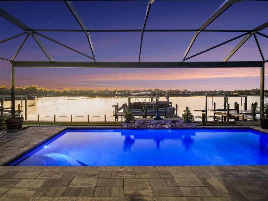 Why settle for a canal when you can have a lake (WITH access to the Gulf)?  Wake up to soft water views, warm morning light, and the kind of peace that makes home feel like an escape. From the moment you arrive through the gated entry and pull onto the sweeping paver driveway with professional lighting, everything about this property feels designed to slow life down in the best possible way.

Open the wall of sliding glass doors and let the coastal breeze move through the living spaces. Spend quiet mornings with coffee overlooking the water, easy afternoons on the lanai, and evenings beside the saltwater pool as the waterfall spills into the background. And when you are ready to get out on the water, you do not have to wait for some future plan to make it happen. This home includes the boat, along with a private dock and 12,000 lb boat lift, so your waterfront lifestyle starts the moment you move in.

Inside, the home blends warmth and function with thoughtful design throughout. Exposed wood ceiling beams bring character to the main living area, creating a space that feels both elevated and inviting. The kitchen has been beautifully refreshed with granite countertops, a gas range, neutral tile backsplash, and reverse osmosis water system. A dedicated office with French doors gives you privacy when needed, while the split layout offers a comfortable guest wing with two bedrooms connected by an updated Jack and Jill bath.

The primary suite feels like its own retreat, highlighted by shiplap tray ceilings and a spa inspired bath with custom framed mirrors, a soaking tub, and a glass enclosed shower. Every space has been carefully considered to make daily living feel easy, comfortable, and refined.

Beyond the home itself, Tidewater Preserve adds another layer to the lifestyle with gated entry and a resort style setting along the Manatee River. Residents enjoy access to resort style amenities that make it easy to stay active, social, and connected to the waterfront setting.

Just as appealing is how connected it feels when you leave the gates. The location offers convenient access to I 75, UTC shopping and dining, downtown Bradenton’s waterfront, the airport, and the area’s well known beaches, so it is easy to enjoy both a tucked away waterfront setting and the everyday convenience of being close to the places people actually want to go.

Outside, the lanai is enhanced with Clearview screening for panoramic water views and motorized screens for added comfort. The finished garage features epoxy flooring and built in storage, while practical upgrades like a whole home water softener, laundry room utility sink, and generator hookup add convenience behind the scenes. Leased solar panels are also in place and can be assumed by the buyer or removed depending on preference.

This is the kind of home that makes it easy to picture a different pace of life. More time outside. More time on the water. More mornings that start slower and evenings that last longer.