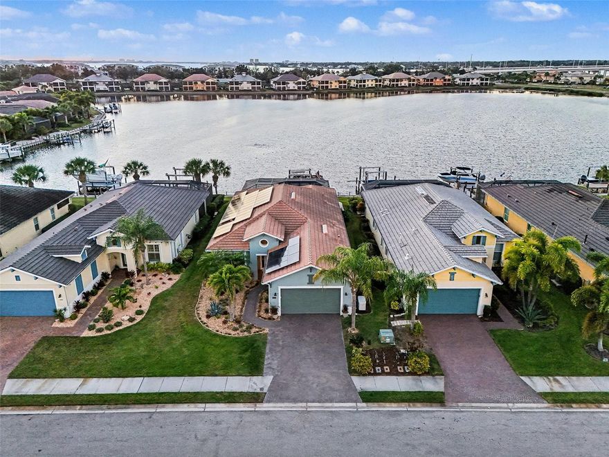 Why settle for a canal when you can have a lake (WITH access to the Gulf)?  Wake up to soft water views, warm morning light, and the kind of peace that makes home feel like an escape. From the moment you arrive through the gated entry and pull onto the sweeping paver driveway with professional lighting, everything about this property feels designed to slow life down in the best possible way.

Open the wall of sliding glass doors and let the coastal breeze move through the living spaces. Spend quiet mornings with coffee overlooking the water, easy afternoons on the lanai, and evenings beside the saltwater pool as the waterfall spills into the background. And when you are ready to get out on the water, you do not have to wait for some future plan to make it happen. This home includes the boat, along with a private dock and 12,000 lb boat lift, so your waterfront lifestyle starts the moment you move in.

Inside, the home blends warmth and function with thoughtful design throughout. Exposed wood ceiling beams bring character to the main living area, creating a space that feels both elevated and inviting. The kitchen has been beautifully refreshed with granite countertops, a gas range, neutral tile backsplash, and reverse osmosis water system. A dedicated office with French doors gives you privacy when needed, while the split layout offers a comfortable guest wing with two bedrooms connected by an updated Jack and Jill bath.

The primary suite feels like its own retreat, highlighted by shiplap tray ceilings and a spa inspired bath with custom framed mirrors, a soaking tub, and a glass enclosed shower. Every space has been carefully considered to make daily living feel easy, comfortable, and refined.

Beyond the home itself, Tidewater Preserve adds another layer to the lifestyle with gated entry and a resort style setting along the Manatee River. Residents enjoy access to resort style amenities that make it easy to stay active, social, and connected to the waterfront setting.

Just as appealing is how connected it feels when you leave the gates. The location offers convenient access to I 75, UTC shopping and dining, downtown Bradenton’s waterfront, the airport, and the area’s well known beaches, so it is easy to enjoy both a tucked away waterfront setting and the everyday convenience of being close to the places people actually want to go.

Outside, the lanai is enhanced with Clearview screening for panoramic water views and motorized screens for added comfort. The finished garage features epoxy flooring and built in storage, while practical upgrades like a whole home water softener, laundry room utility sink, and generator hookup add convenience behind the scenes. Leased solar panels are also in place and can be assumed by the buyer or removed depending on preference.

This is the kind of home that makes it easy to picture a different pace of life. More time outside. More time on the water. More mornings that start slower and evenings that last longer.