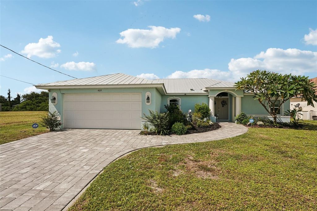 Photo of 409 Boundary Boulevard, Rotonda West, FL 33947 (MLS # A4667999)