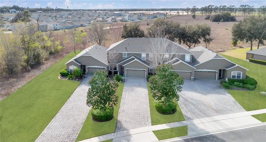 Low-maintenance golf course living in Sorrento, Florida, in the guard-gated Sorrento Springs community near Mount Dora. This 4-bedroom townhome at 24008 Sardinia Drive in Lake County offers over 2,500 square feet, a rare first-floor primary suite, an open layout, and no rear neighbors for added privacy. Inside, you’ll find soaring ceilings, fresh interior paint, and a layout that flows seamlessly from the kitchen into the main living and dining areas, making it ideal for both everyday living and entertaining. The spacious primary suite features two walk-in closets and a spa-style bathroom, while upstairs includes a large bonus room, three additional bedrooms, and two full bathrooms, offering flexible space for guests, a home office, or media room. Major updates, including a new roof and A/C in 2023, provide peace of mind. Enjoy relaxing on the screened-in porch overlooking a private backyard, and take advantage of resort-style amenities including Eagle Dunes Golf Course, clubhouse, pool, fitness center, tennis courts, and more, with HOA-covered lawn care, irrigation, and exterior maintenance for easy living. Conveniently located in Sorrento near Mount Dora, Lake Mary, Sanford, and Orlando, with easy access to shopping, dining, and major highways, this home offers the space, lifestyle, and Central Florida location today’s buyers are searching for.