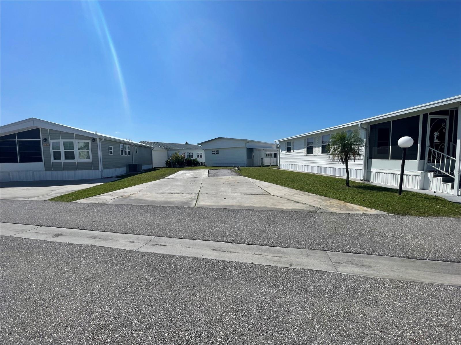 Rare lot in Sugar Creek Country Club! Park is gated 55 + Community has 2 swimming pools, tennis courts, clubhouse with gym & pool tables, library and many scheduled activities . Lot can have a Permanent park model mobile home installed or also be used for RVs with adjustments to the electric box set up. Affordable HOA fees $175 a month or $525 a quarter and includes yard service, water, sewer, garbage, basic cable, internet and all the activities in the park.