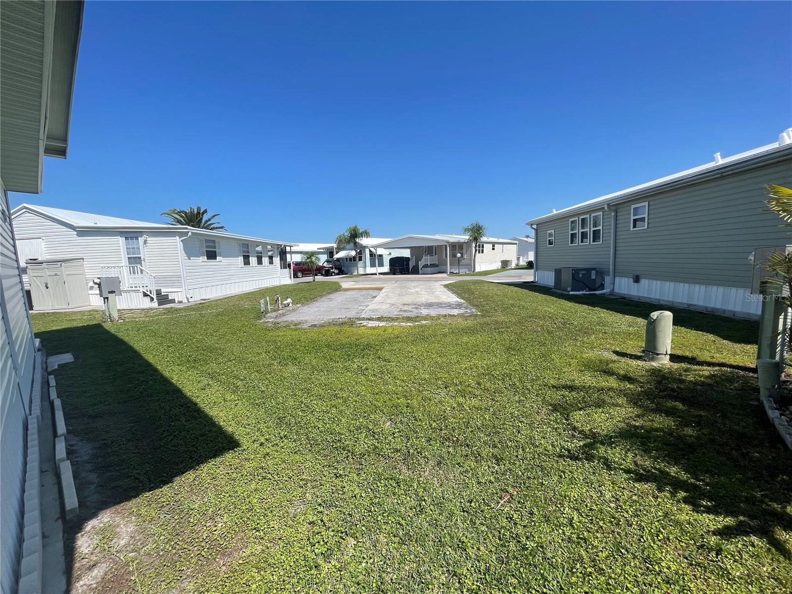 Rare lot in Sugar Creek Country Club! Park is gated 55 + Community has 2 swimming pools, tennis courts, clubhouse with gym & pool tables, library and many scheduled activities . Lot can have a Permanent park model mobile home installed or also be used for RVs with adjustments to the electric box set up. Affordable HOA fees $175 a month or $525 a quarter and includes yard service, water, sewer, garbage, basic cable, internet and all the activities in the park.