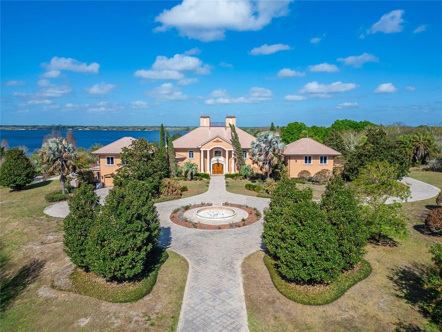 Beyond the gates of Casa Bella, a remarkable lakefront estate unfolds across almost 13 private acres along the shores of Lake Van in the heart of Central Florida.

Tucked away at the end of a long, scenic driveway with breathtaking lake views, this extraordinary residence offers a rare combination of privacy, scale, and refined traditional design, all just minutes from Interstate 4 and within easy reach of both Tampa and Orlando.

Built in 2002 and offering over 9,200 square feet of living space, the home welcomes you with a dramatic grand foyer with stunning crystal chandelier and sweeping staircase that sets the tone for the elegance throughout. Designed for both entertaining and everyday living, the estate features a chef’s kitchen equipped with Sub-Zero and Thermador appliances, multiple formal and casual dining spaces, and expansive living areas filled with natural light and serene views of the surrounding landscape.

The luxurious primary suite serves as a private retreat with dual bathrooms, custom closets, and terrace access overlooking the grounds and lake. Additional accommodations include four spacious guest bedrooms, a private study with an en-suite bathroom, and a separate in-law suite ideal for extended family or guests.

Resort-style amenities elevate the lifestyle experience, including a waterfall pool, sauna, tennis court, and private boat dock on motorized Lake Van, perfect for boating, fishing, and sunset cruises.

Surrounded by mature trees and natural beauty, the property offers exceptional privacy while remaining conveniently located just six miles from I-4, placing world-class dining, airports, and major business centers within easy reach.

With multiple garages, upgraded systems, and panoramic waterfront views, Casa Bella represents a rare opportunity to own one of the most distinctive private lake estates in the region.

A property of this scale and setting is rarely available, offering the perfect blend of luxury living, natural beauty, and Central Florida accessibility. There are 3 other parcels totaling approximately 31 acres to be sold separately.