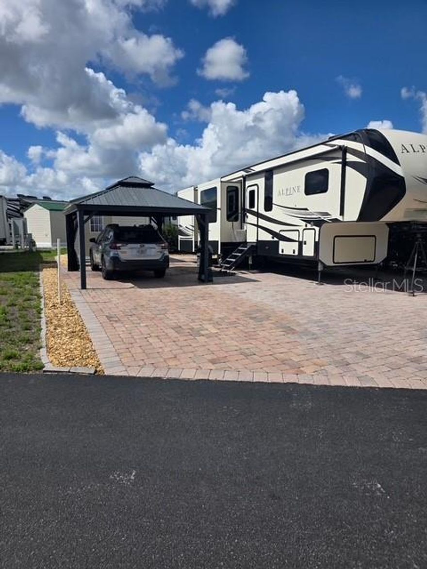 RV lot is near the laundry and bathhouse it is in the much sought-after Elite Resorts at Citrus Valley. Lot 142 is located a short walk to the clubhouse and pool area. It is a spacious lot with a 10x12 shed with water, electricity, washer & dryer. It also has a wall of tall vegetation for privacy extra pavers and a gazebo to make it your own piece of paradise. The association allows RV's, sheds, ParkModels with porches and gazebos. A well maintained high quality resort that is only approximately 12 miles from Disney and 13 miles from the quaint downtown Clermont area with weekly farmers markets, food truck events and more. The resort also has two bath houses, laundry facilities, social events and entertainment. This property has the ability for short term rental to either use it part time and rent it the remanding the time or stay full time yourself. Call or email Diana for more information.