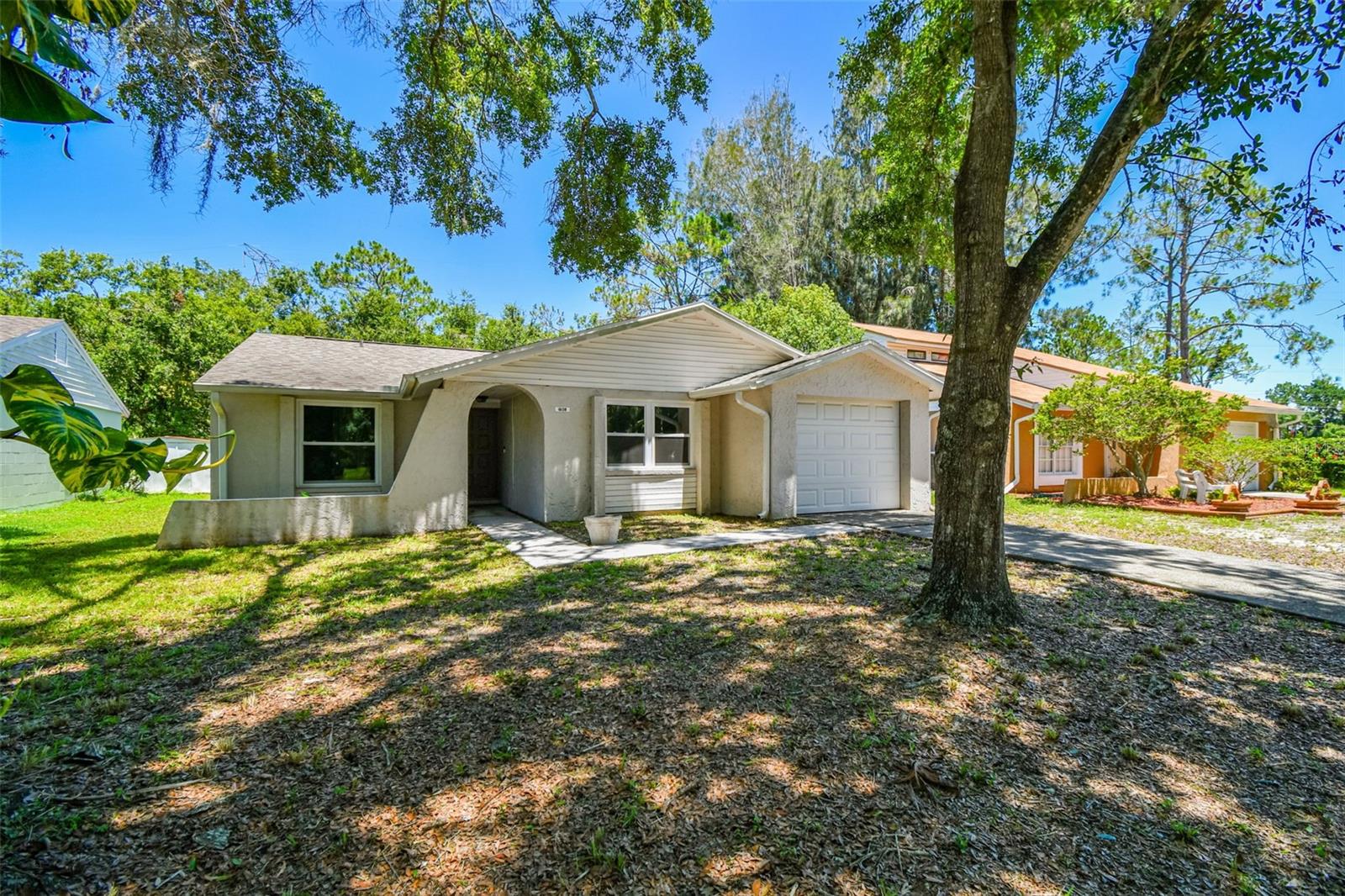 Welcome to this beautifully updated 3-bedroom, 2-bathroom block construction home in the highly desirable Northdale neighborhood of Tampa. Situated on a scenic lot with tranquil pond and conservation views, this move-in ready residence offers a thoughtfully designed split-bedroom layout and a spacious Great Room plan. The modern kitchen, remodeled in 2024, features sleek white cabinets, granite countertops, and stainless steel appliances, while recent upgrades include custom vinyl impact windows and sliders (2025), a new water heater (2024), and a new roof (2020). Additional highlights include a renovated bathroom, updated fixtures throughout, and an enclosed one-car garage. Located in an A+ rated school district, including the sought-after Steinbrenner High School zone, this home offers quick access to the Veterans Expressway, I-275, downtown Tampa, and the beaches. Enjoy the convenience of nearby shopping, dining, medical facilities, and recreational amenities like the YMCA, Northdale Community Center, golf, tennis, parks, and trail systems. With no CDD or mandatory HOA fees and no flood zone, this property combines comfort, convenience, and value in one of Tampa’s most established communities