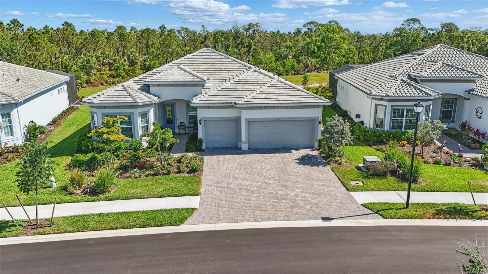 Why build When Perfection Already Exists? If your dream is to build the perfect home on a dream lot—complete with every amenity imaginable—but you’d rather skip the long and stressful construction process, then your dream is about to become true. Welcome to your new sanctuary, a state-of-the-art smart home situation on one of the most desirable lots in Beachwalk, offering tranquil water and preserve views at the end of a peaceful cul-de-sac.
This custom-built home was crafted with precision and passion, incorporating cutting-edge SMART HOME technology, automated lighting, a full security system and remote controls that allow you to manage everything from your phone or table—no matter where you are in the world.
Built to withstand Florida’s weather, this home features impact windows and doors, including the front entrance, and Storm Smart roll-down shades for added protection over the lanai area. A whole-house gas generator ensures uninterrupted comfort and peace of mind. Developed by Divosta, a builder with over 70 years of excellence, Beachwalk is the crown jewel of resort-style living – just 2.5 miles from Manasota Beach. The community boasts a state-of-the-art fitness center, a resort-style pool with beach-like lounging areas, a restaurant and tiki bar, tennis and pickle ball courts, and a vibrant calendar of community events. Residents often gather lakeside at sunset sharing stories and building friendships.
Back to the heart of the home which a gourmet kitchen designed for both elegance and functionality. Enjoy upgraded cabinetry with pull-out drawers, top-of-the line KitchenAid Appliances, a Blanco sink, under-cabinet lighting, quart countertops and a reverse osmosis system for cooking and drinking water. A custom pantry is built out with shelving for ultimate organization.
Step outside through the zero-corner sliding doors, which open the interior complexly to the outdoor living space. The outdoor kitchen is fully equipped with a grill, sink, dishwasher and refrigerator - perfect for year round entertaining. The saltwater pool and spa are heated and elegantly lit. The lanai is set over a concrete foundation to prevent shifting, weeds or pests – offering a worry-free relaxation. Let’s not forget the 3 car garage with durable epoxy finish.
While words can paint a picture, the photos and virtual tour will show you just how extraordinary this home truly is. A full list of updates and features is available upon request.
Why build when you can move right into your dream home now? Call today for your personal or facetime tour.
