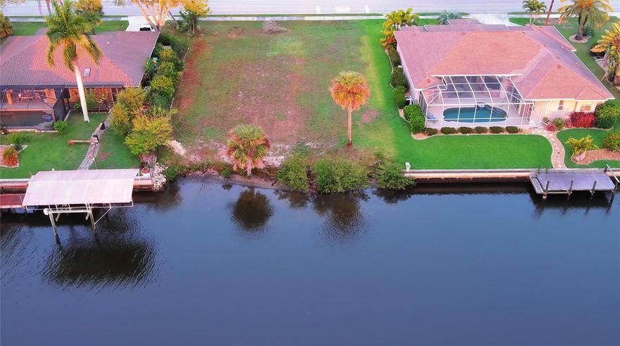 An exceptional opportunity to create a custom residence in one of Port Charlotte’s rapidly evolving residential enclaves. This prime homesite on Lake View Blvd offers the perfect canvas for a refined Florida lifestyle, where privacy, space, and design come together seamlessly.
Surrounded by newer construction and upscale homes, this property invites you to build with intention, whether envisioning a modern coastal retreat or a timeless estate. The location offers effortless access to world-class fishing, boating, golf courses, fine dining, and boutique shopping throughout Punta Gorda and nearby coastal destinations.
Enjoy proximity to the Gulf’s pristine beaches, private marinas, and vibrant waterfront districts, all while tucked away in a quiet, residential setting. With no HOA restrictions, you have the freedom to design and build a residence that reflects your Florida Lifestyle.