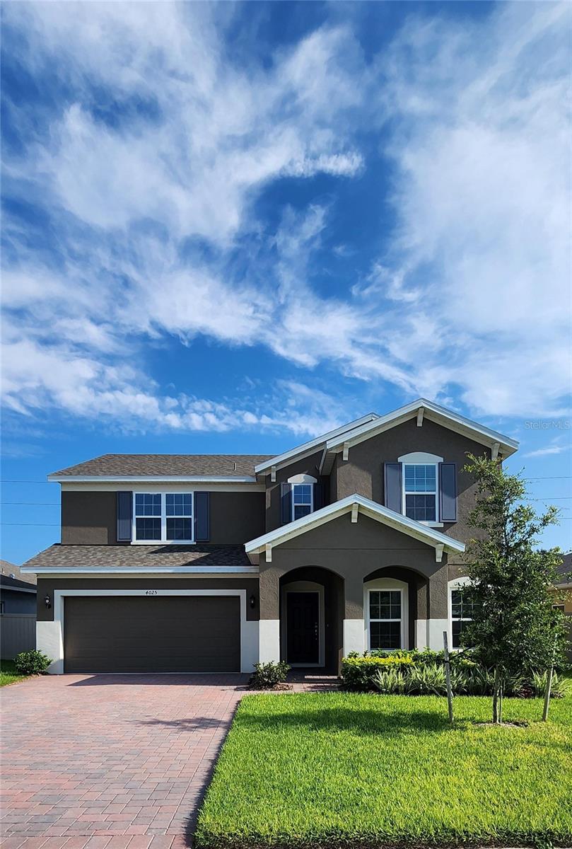 Discover this beautifully designed 4 Bedroom, 2.5 Bath home featuring tile flooring in the first-floor main living areas. Enjoy the ease of an open concept layout with a spacious Family Room and Dining Area that opens to the covered rear lanai—perfect for indoor-outdoor living. The modern Kitchen is equipped with 42" cabinets with crown molding, elegant quartz countertops, a center island, a generous pantry closet, and stainless appliances including refrigerator. Upstairs, a versatile Loft provides additional living space - perfect for gatherings or a media room. The Primary Suite offers a luxurious retreat with ensuite Bath including a walk-in shower featuring upgraded wall tile surround, rain-head fixture, and a sleek frameless glass enclosure. Window blinds throughout add comfort and convenience to this move-in ready home. Lake Lincoln amenities include a dog park, walking trail, and a playground / tot lot with plenty of shade for the littles under a cluster of shady oak trees. Conveniently located close to schools, Publix shopping center, Target, and Walmart. Just a short 6 minute drive to the quaint downtown areas of Mount Dora & Eustis, with easy access to major thoroughfares.