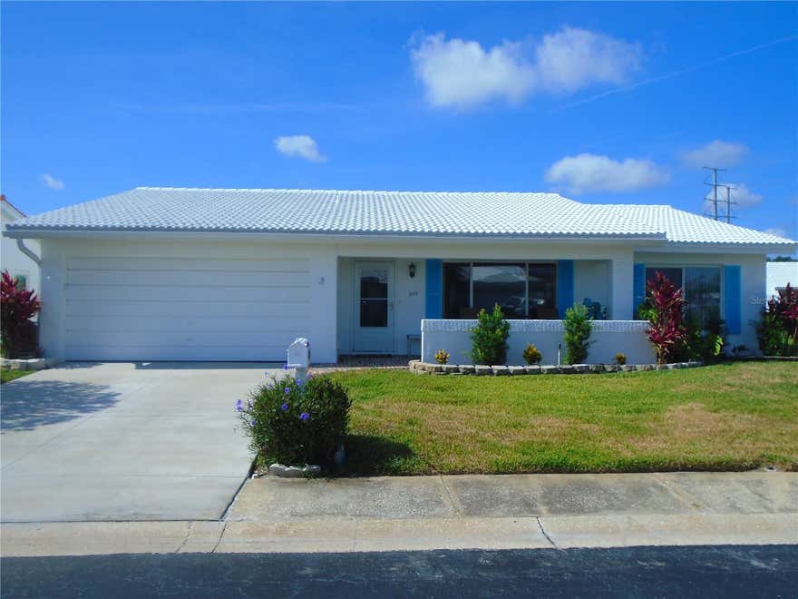 Golfers, snowbirds, beach goers... great opportunity to own a fantastic home on Florida's Gulf Coast in Pinellas County.  Located close to Mainland's Unit 6 clubhouse and pool, this well cared for 2 bedroom/2bath/2Garage has easy access to community amenities and social events. No carpet, laminate and tile floorings. The eat-in kitchen features large pantry area. The den (no closet) could be utilized as a third bedroom.  Primary ensuite bath has walk-in shower with newer wainscots.  Hall bath has bathtub with shower.  Unit 6 allows 2 pets! CHA unit installed 2/2025.  Mainland's is an active 55+ community offering clubhouse, heated in-ground pool, shuffleboard courts, public golfcourse & many other activities. All located near shopping, sporting/cultural venues, excellent medical/emergency care facilities, restaurants, banking, churches and easy access to beatiful Gulf coast beaches, interstates and two airports.