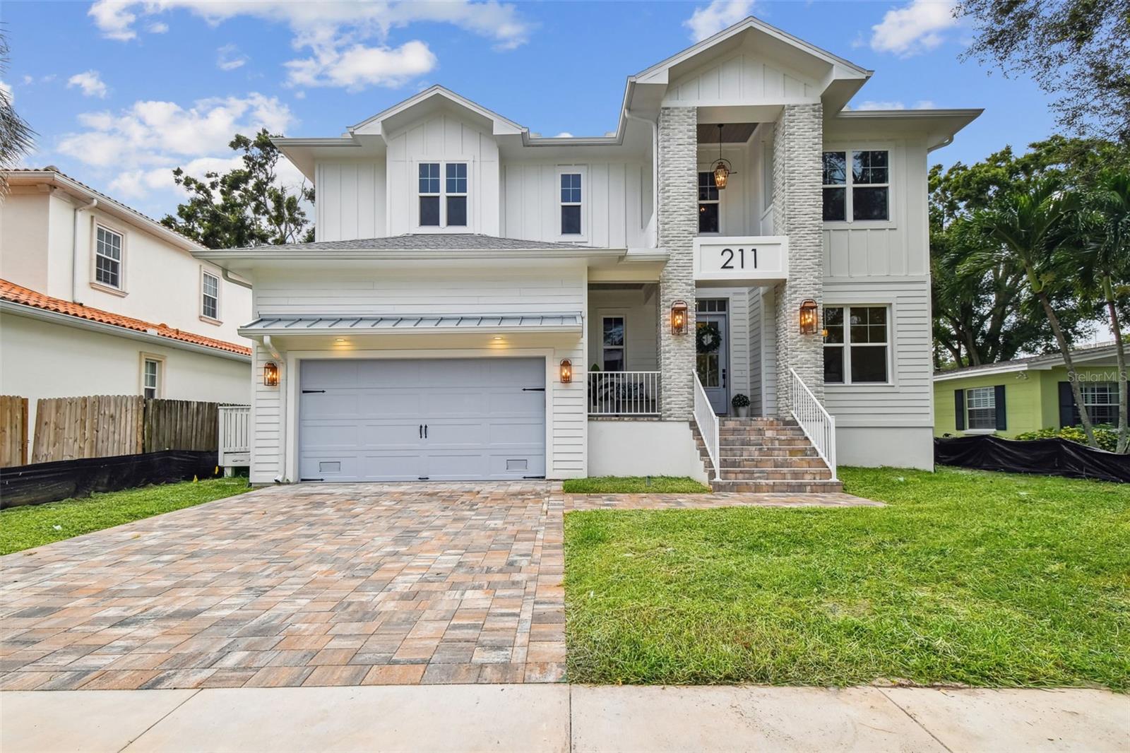 Exquisite New Construction in South Tampa
Welcome to an architecturally stunning new build in the heart of South Tampa, where impeccable craftsmanship meets contemporary elegance. Thoughtfully designed with high-end finishes and custom details, this 5-bedroom, 4 -bathroom home spans 4,030 square feet and is built above the floodplain for peace of mind.
Unparalleled Design & High-End Finishes
Step inside to an open-concept living space where engineered hardwood floors, 7” cove crown molding, and designer fixtures create an atmosphere of luxury. The chef’s kitchen is a showstopper, featuring Calacatta Imperiale Quartz countertops, Hancock 5-piece cabinetry in Glacier and Maple Drift, a 48” gas professional range, a farmhouse sink, and a Delta pot filler in Champagne Bronze. A spacious island offers additional seating and prep space, while the custom pantry provides ample storage.
The living area centers around a striking fireplace with a Picture Frame TV included, a perfect blend of technology and elegance. Impact-rated windows flood the space with natural light, while the custom-trimmed dining room adds a touch of classic sophistication.
Primary Suite Retreat & Luxe Bathrooms
The expansive primary suite is a private oasis featuring a spa-inspired bathroom with a soaking tub, dual vanities, Quantum Quartz countertops in Dulche De Leche, a rain shower with a handheld option, and polished Champagne Bronze fixtures. Upstairs, two bedrooms share a beautifully designed Jack-and-Jill bath, while an additional guest suite features Dolche Vita Quartz and polished nickel fixtures.
Seamless Indoor-Outdoor Living
Designed for Florida living, this home offers an inviting lanai with Synergy nickel groove stained wood ceilings. The fully equipped outdoor kitchen boasts a Blaze built-in natural gas grill, mini fridge, leathered granite countertops, built-in trash can, tile backsplash, and stainless-steel hood, perfect for entertaining. The backyard is a private retreat, complete with a custom-built pool and spa for year-round enjoyment.
Additional Features & Prime Location
Epoxy-coated garage with impact-rated doors
Smart home technology & premium lighting throughout
Elevated construction for flood protection
Minutes from top-rated schools, dining, shopping, and major highways
This home redefines modern luxury and the finishing touches are already underway. Schedule your private tour today before it’s gone!