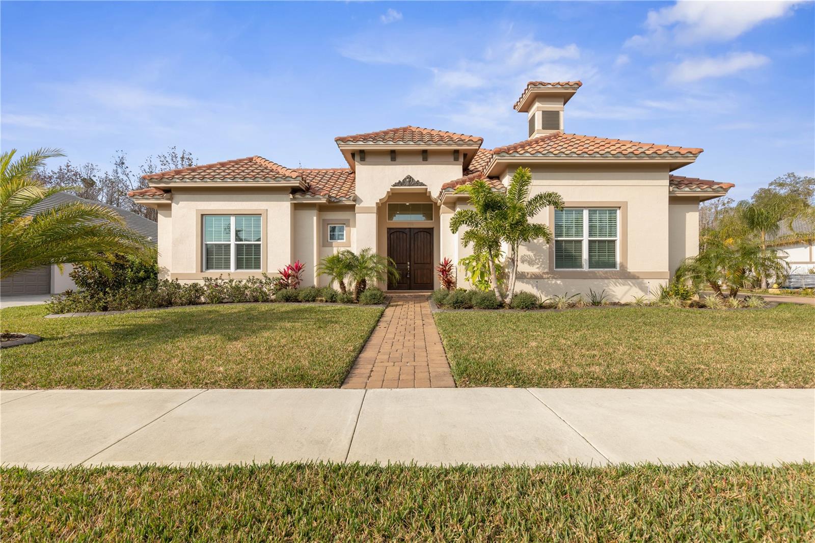 One or more photo(s) has been virtually staged. One or more photo(s) has been virtually staged. This masterfully built, Tuscany inspired home is located in the amazing community of Toscana. It is sure to please the most discriminate buyers. Toscana is a charming development that has captured the very essence of Italian-inspired living with grand, architecturally detailed homes that are an expression of what defines old-world character and classic European charm. The owners spared no expense building and upgrading the home to ensure a cozy, relaxed luxury experience for themselves and now they would like to share it with you. The home wraps around an enormous, completely private courtyard that seamlessly combines the outdoor living space with indoor living areas when you open the sliding glass doors that surround it. There is plenty of room for a pool if that is important however the sellers are including a new, $10,000 hot tub for your enjoyment and relaxation. Enter the home through beautiful double wooden doors to be greeted by peaceful views of the preserve via the spacious living room. Turn the corner to find the beautiful kitchen with an amazing, spacious quartz island that is perfect for entertaining, and family room with a cozy gas fireplace. There is a fabulous rectangular tinted window above the cooktop that creates a wonderful openness and natural light. The primary bedroom is spacious and has a beautiful view of the courtyard. The primary bathroom has beautiful views of the preserve, a large tub to relax in after a long day, a separate shower and a large custom walk-in closet. There are two additional bedrooms, and an in-law suite/casita. This space is an open pallet that can be enjoyed as an art studio, office, craft room – anything you need. The oversized 3 car garage has epoxy floors and lots of storage. The large back yard is fully fenced so your cuddly, furry family members will have plenty of room to run around and enjoy the Florida sunshine and warm breezes. The quiet, soft coquina beaches that Flagler County is known for is only a short drive away. Flagler County is located on the Atlantic, Central Florida Coast and is just a one hour to Jacksonville or Orlando and 30 minutes to Daytona Beach or Saint Augustine. Come see why the Locals call Flagler County "Paradise" and why visitors return year after year. Schedule an appointment today and begin living the Florida dream life!