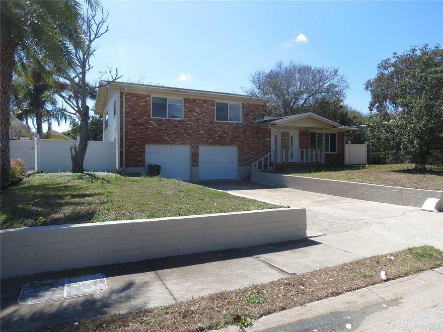 This Ormond Beachside 3-bedroom, 2 bath Tri level home has Hardwood and tile floors. Extra-large 2 car garage for all your stuff! Fenced yard, irrigation, washer/dryer hook-ups and lawn care included. Great family home with good schools! No pet please 1st, last and security.