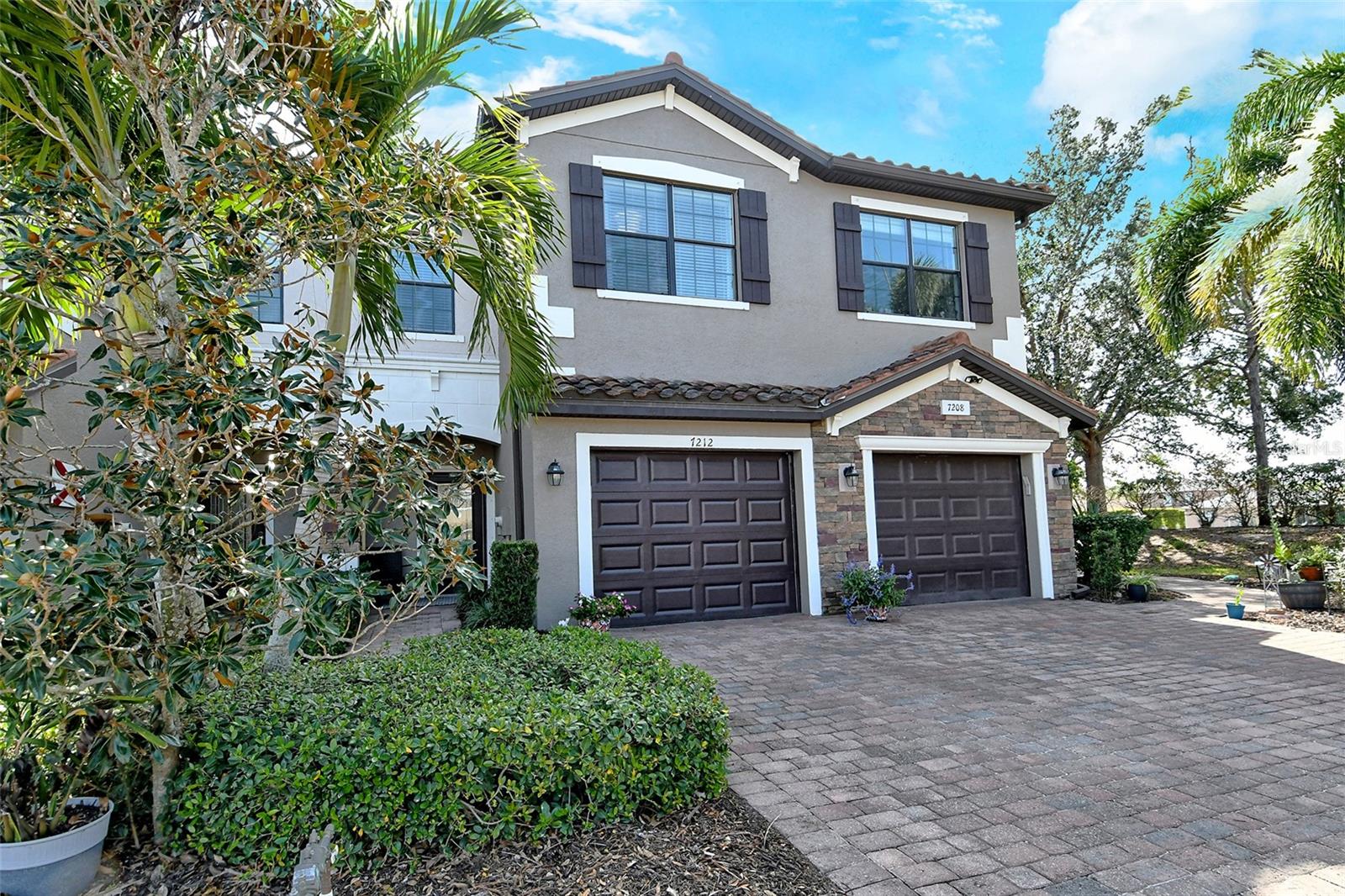 Exceptional 3 bedroom, 2.5 bathroom townhome, turnkey furnished for your ease. Regatta Landing provides maintenance-free living in a small enclave of Heritage Harbour, a beautifully designed master community with extensive amenities. First floor living space includes a great room, kitchen, dining area, half-bath, screened lanai and a single car garage. Nearly 2,000 square feet, this 2016 build has been refreshed and is move-in ready with tile floors throughout the main level. You'll appreciate the kitchen with dark cabinetry, granite countertops and stainless appliances. The great room and dining area share private/green views through the sliding doors, out to the screened and covered lanai. All bedrooms are carpeted and on the 2nd level. The generous primary suite features a tiled shower, dual sinks and a walk-in closet. A guest bath is situated just outside both the 2nd and 3rd bedrooms. No lugging laundry up the stairs, washer & dryer are situated on the 2nd level. Ideal location close to the interstate and 2 exits from University Town Center's shopping and dining mecca. Whether seeking a full-time residence, winter get-away or a solid rental investment... this will suit all your needs. Surrounded by parks, walking paths, golf and recreation... this will define a Florida lifestyle for you.
