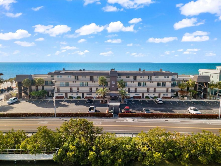 Welcome to the exclusive Happy Fiddler at the Narrows of Indian Rocks Beach. This stunning top-floor penthouse at 60 Gulf Blvd, Unit 402 offers breathtaking 360-degree views of both the Gulf of Mexico and the Intracoastal Waterway. Spanning 1,795 sq ft, the 2-bedroom, 2.5-bath layout features a spacious great room and an open kitchen, perfect for entertaining or relaxing after a day at the beach. The split-bedroom design provides privacy for guests, while the master suite showcases mesmerizing beach views, a luxurious ensuite bath, and a generous walk-in closet. Offered fully furnished and operating as an active vacation rental, this property is completely turnkey ready to continue generating income or serve as your personal coastal retreat. Building amenities include a heated pool and a bayside fishing dock, and the prime location places you just steps from sugar-white sands, local dining, and shops. Whether for investment or personal enjoyment, this penthouse delivers the ultimate Indian Rocks Beach lifestyle.