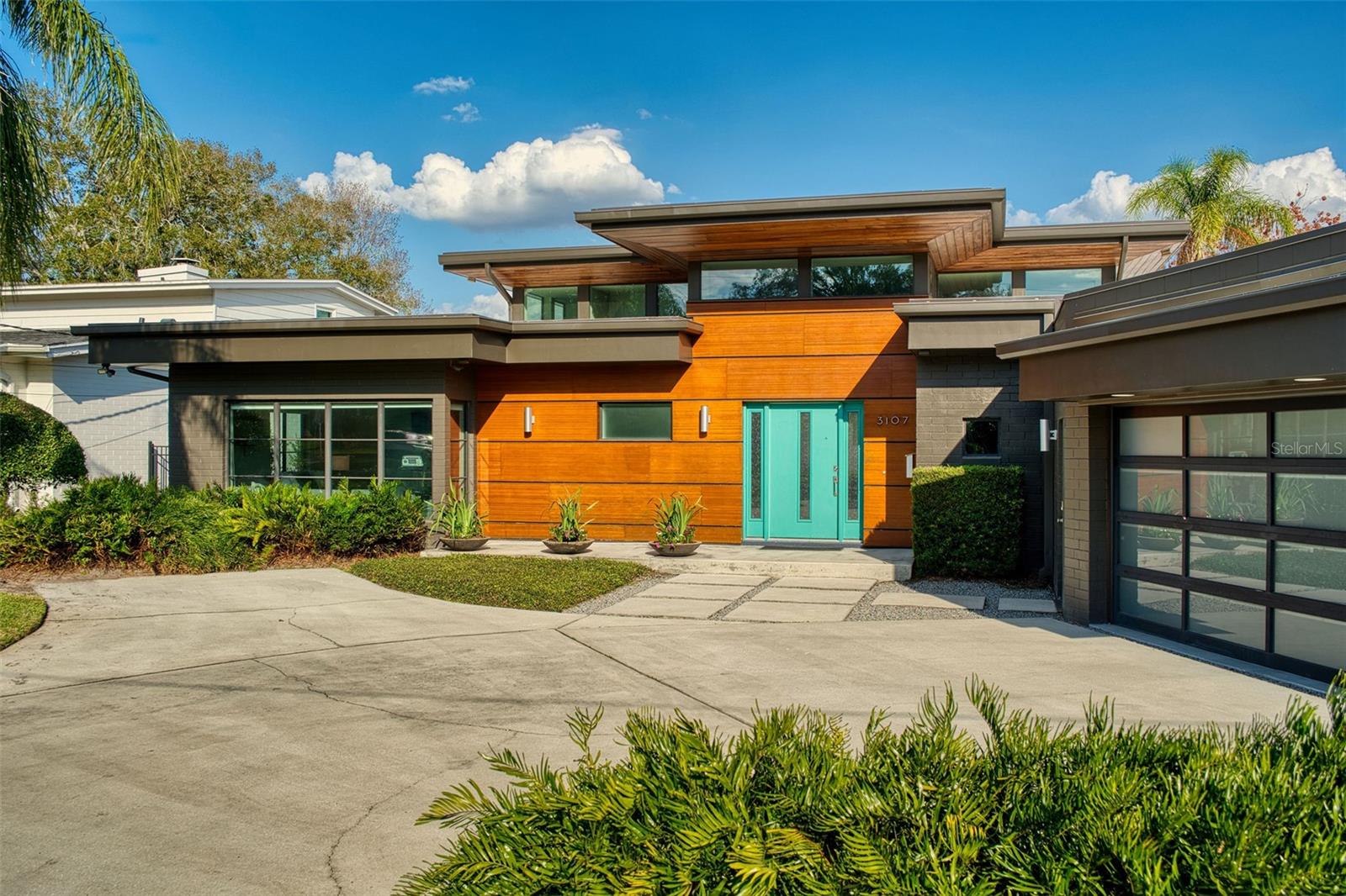 Mid-century modern perfection meets lakefront luxury on sought after Lake Silver in the heart of College Park! This 4 bedroom architectural gem captures the essence of effortless lakeside living with open concept spaces, walls of glass showcasing stunning water views, and timeless mid-century design. The sleek kitchen flows seamlessly into spacious living and dining areas, ideal for entertaining or unwinding while soaking in the serene scenery. Outside, the covered boat dock invites endless days on the water, while the vibrant shops and restaurants of College Park are just a short stroll away. A rare opportunity to own a piece of modern history with unbeatable lakefront lifestyle!