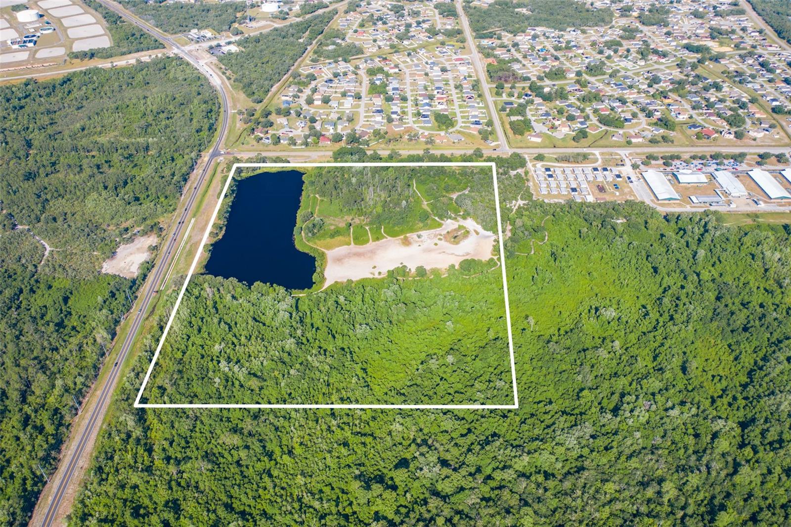 Discover a rare jewel in Poinciana, Florida— a sprawling 45-acre residential oasis poised for transformative development or as a grand personal estate. Nestled at Laurel Avenue 34759, this expansive property is a canvas awaiting your vision, with boundless potential for a vibrant new community or a private retreat.
The land is bathed in the natural beauty of Central Florida, featuring a serene pond that mirrors the sky and adds a touch of tranquility. Envision luxurious homes or quaint cottages dotting the landscape, each with views of the water and access to nature's bounty. The property’s generous dimensions are bordered by S. Laurel Ave. and Poinciana Parkway, ensuring easy access and excellent visibility.
Take advantage of this prime location, where the whisper of the breeze through the trees and the peaceful waters create a backdrop for innovation or secluded living. Whether you're a developer looking to imprint your mark on Poinciana’s landscape or an individual craving space and privacy, this land offers an unparalleled opportunity to dream big and build bigger. Embrace the chance to shape the future in a place where possibilities are as wide as the property’s vast horizons.