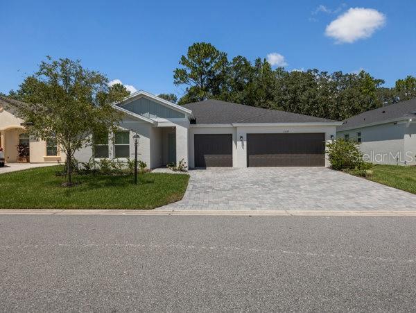 Welcome to The Palmetto – A Smart, Stylish Retreat in Cherrywood Preserve
Discover The Palmetto, a thoughtfully designed single-story smart home nestled on a PREMIUM LOT in the sought-after 55+ gated community of Cherrywood Preserve in Ocala, FL. This spacious home features a convenient 3-car garage and a modern layout tailored for comfort, flexibility, and ease of living.
Step inside through the inviting foyer, where you’ll find a private bedroom and full bath—ideal for guests or multi-generational living. A versatile DEN offers the perfect space for a home office, craft room, or quiet retreat.
At the heart of the home, the open-concept kitchen, dining, and living areas are perfect for entertaining or everyday living. The modern kitchen boasts Whirlpool appliances, ample counter space, and a seamless flow into the expansive great room and covered lanai—perfect for enjoying Florida’s indoor-outdoor lifestyle.
The owner’s suite is a true sanctuary with a large bedroom, luxurious en-suite bath, and a generous walk-in closet. Additional features include an inside laundry room and SMART HOME technology such as a smart thermostat, Rainbird irrigation system, and smart door lock.
Located in a golf cart-friendly community, Cherrywood Preserve is just minutes from The Market at Cherrywood, offering easy access to shopping, dining, and I-75. Residents enjoy resort-style amenities including a lap and lounge pool, jacuzzi, fitness center, billiards, pickleball, bocce, horseshoes, and more, along with a vibrant calendar of social events year-round.