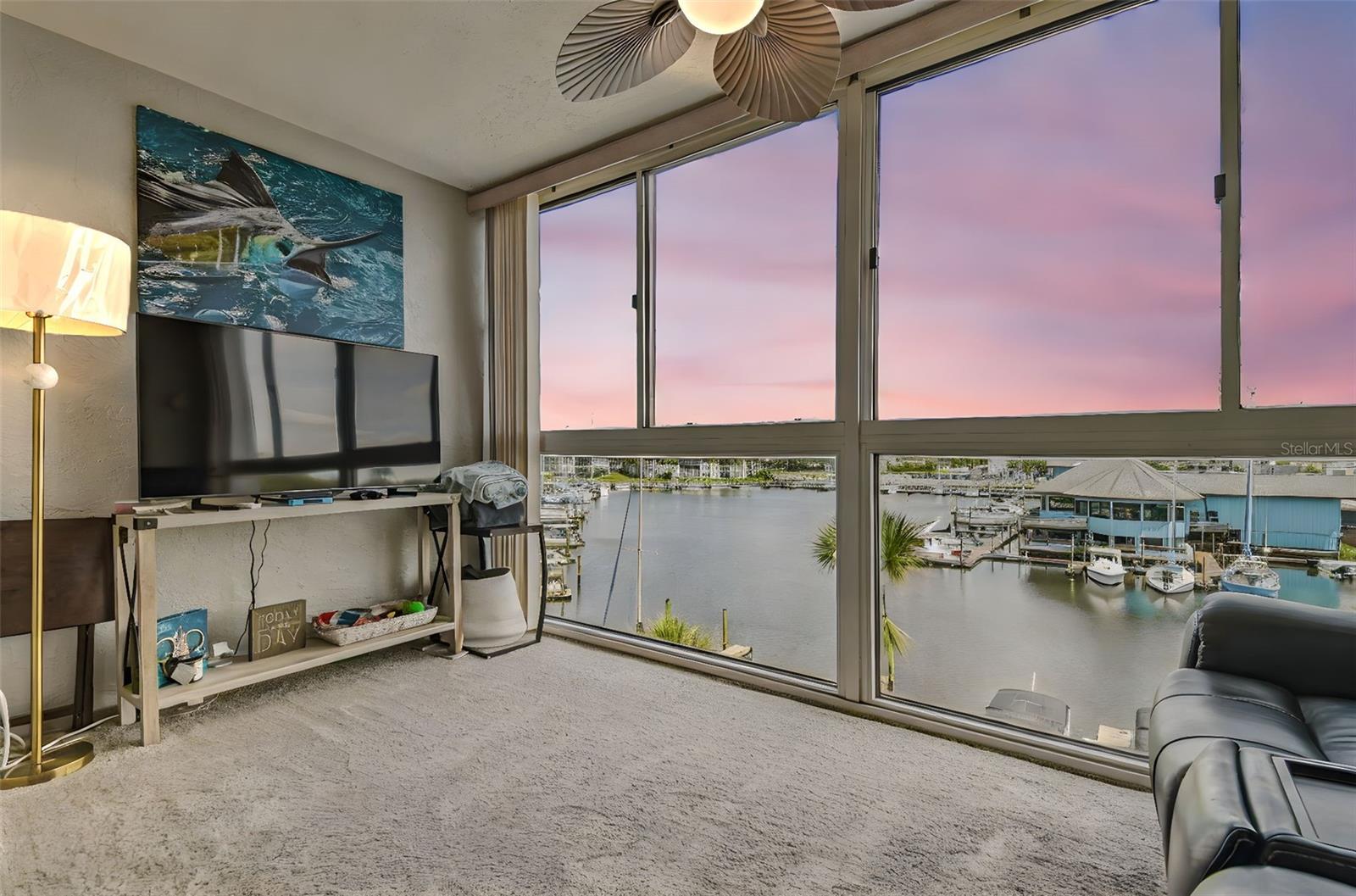 Experience stunning waterfront living in this beautifully updated 3-bedroom, 2-bath condo located on the 4th floor of the sought-after Sea Castle community, offering 1,437 sq ft of spacious comfort and unobstructed views of the North Channel in Gulf Harbors. The open layout features a newly remodeled kitchen with quartz countertops, stainless steel appliances, and modern cabinetry, complemented by brand-new luxury vinyl flooring throughout the main living area. A fully enclosed, heated and cooled Florida sunroom expands your living space and provides the perfect setting to enjoy morning coffee or evening sunsets over the water. Both bathrooms have been refreshed with clean, pleasant finishes that blend seamlessly with the home’s coastal charm. Unit comes with parking spot and a storage unit! Sea Castle offers resort-style amenities such as a waterfront heated pool and sun deck, gazebo with BBQ grills, shuffleboard, workshop, library, game room, secure lobby, laundry facilities, personal storage units, bike/kayak storage, and access to private boat slips and two boat ramps with direct Gulf access. Optional membership to Gulf Harbors Beach Club provides exclusive beach access just a mile away. Instant Gulf access with no bridges ideally located near downtown New Port Richey, you’re minutes from parks, marinas, dining, shopping, hospitals, and award-winning beaches like Fred Howard Park and Caladesi Island—this is your chance to embrace the ultimate Florida lifestyle.