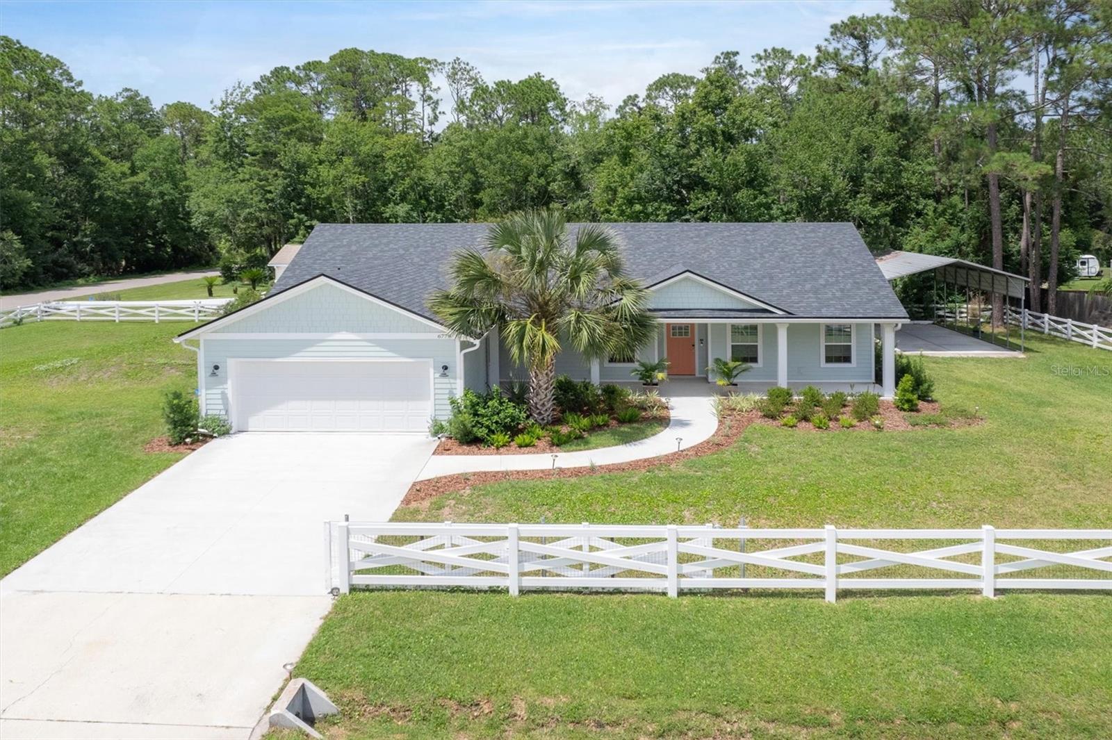 Welcome to this beautifully crafted 2024 home on a spacious half-acre, corner lot in St. Augustine. This 4-bedroom, 3-bath property offers nearly 1,800 square feet of open living with luxury vinyl plank flooring, upgraded tile, and elegant top-down bottom-up window shades. The gourmet kitchen features granite counters, upgraded cabinetry, a large island, and upscale fixtures. The flexible 4th bedroom doubles as a private office with a garage entrance and half-glass door with pet door. Enjoy a separate laundry room with sink, spacious front and back covered porches, remote patio blinds, an outdoor shower, and a fully fenced yard with kid/pet safety mesh and two gates. The oversized 2-car garage includes plumbing for a future bath or pet wash and a half-glass door. Also included: covered RV/boat port with pad, extra-large powered shed, tankless water heater, gutters with rain barrels, and smart features. All just 5 minutes to Crescent Beach and I-95.