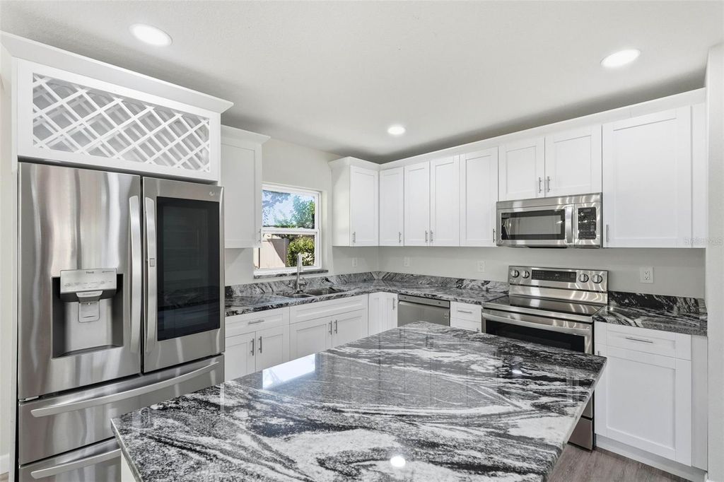 Photo of 1713 Valencia Drive E, Largo, FL 33778 (MLS # TB8438281)