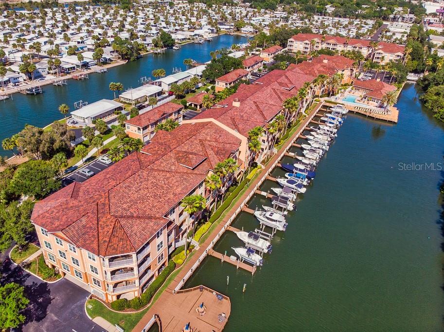 Waterfront living meets modern comfort at Culbreath Key! This beautifully maintained 1-bedroom, 1-bath condo offers 654 sq ft of stylish living space in a secure gated community right on Tampa Bay. Inside, you’ll find updated wood-look tile flooring throughout, fresh paint, and a bright, open layout. The kitchen shines with granite countertops, white cabinetry, and plenty of storage, while the bathroom carries the same crisp, upgraded finishes. The spacious bedroom features an ensuite with a walk-in closet and a window overlooking the water, creating a peaceful retreat. Practical updates include a 2021 AC system and the convenience of elevator access leading to your unit. The community has also recently installed new tile roofs, adding long-term value and peace of mind. Step outside and enjoy all that Culbreath Key has to offer: direct water access to Tampa Bay, a scenic boardwalk, community docks, a resort-style pool, a fitness center, a clubhouse, grilling stations, and secure gated entry. Covered parking is included, and the location couldn’t be better—just minutes to St. Pete, downtown Tampa, restaurants, shopping, and major highways. Whether you’re looking for a full-time residence or a weekend retreat, this condo blends low-maintenance living with the charm of waterfront amenities.