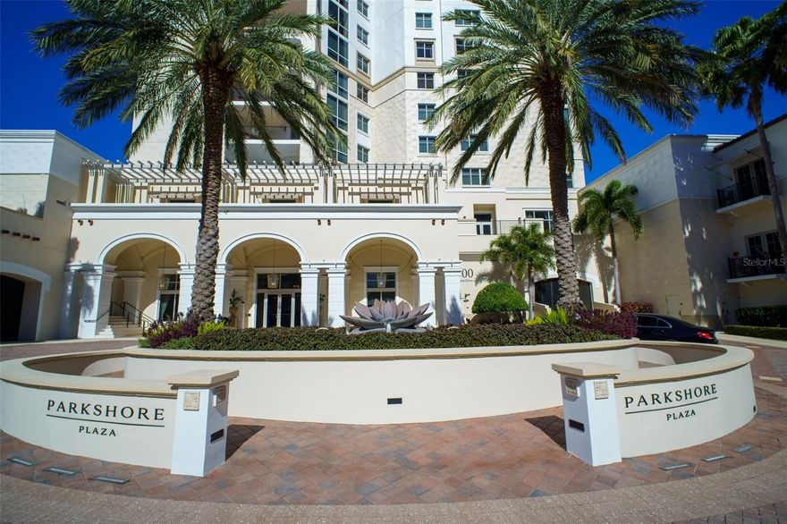 LUXURY LIVING WITH SWEEPING WATER AND CITY VIEWS IN THE HEART OF DOWNTOWN ST. PETERSBURG
Experience refined urban living at Parkshore Plaza, one of downtown St. Petersburg’s most distinguished luxury towers. This prestigious residence offers breathtaking, front-row views of Tampa Bay, the vibrant downtown skyline, and the surrounding waterfront parks that frame the city’s iconic landscape.
The expansive covered wraparound balcony, accessible from three separate interior points, serves as an extraordinary outdoor living space where the views stretch from east to west, creating a constantly evolving panorama of sparkling bay waters, passing boats, glowing sunsets, and the distant silhouette of the Sunshine Skyway Bridge. It is the perfect setting for morning coffee, evening cocktails, or simply taking in the beauty of St. Petersburg’s waterfront lifestyle.
Inside, this elegant 3-bedroom, 3.5-bath residence spans 2,767 square feet of thoughtfully designed living space, ideal for both everyday comfort and gracious entertaining.
Upon exiting the elevator, you are welcomed into your own private entry lobby, a coveted feature that enhances both privacy and security.
The interior showcases newly installed wood flooring, bringing warmth and sophistication to the home while complementing the timeless architectural finishes. The foyer opens into a spacious great room where walls of glass frame spectacular views of Tampa Bay and the surrounding parks.
Every window is appointed with either high-end white plantation shutters or adjustable mesh blinds, allowing natural light to fill the space while maintaining comfort and privacy.
The well-appointed kitchen blends functionality with style, featuring tropic brown granite countertops, a gas cooktop, smart refrigerator, rollout pantry shelving, abundant cabinetry, and recessed lighting. An inviting eat-in kitchen vestibule and convenient dry bar create additional space for hosting and entertaining.
The expansive primary suite provides a private retreat with two oversized walk-in closets and a spacious ensuite bath highlighted by dual granite-topped vanities and a large soaking tub. The additional bedrooms are equally well proportioned, including a second bedroom with its own generous walk-in closet.
This residence also includes two secure parking spaces, along with a large private storage unit.
Residents of Parkshore Plaza enjoy an exceptional suite of amenities, including 24-hour concierge service, on-site management, heated pool and spa, fitness center with massage room, billiards room, business center, library, and an elegant social room with full kitchen, bar, formal dining space, and private balcony. The building’s lavish fountains, marble finishes, and Mediterranean-inspired architecture create a sense of timeless grandeur throughout.
Perfectly positioned in the epicenter of downtown St. Petersburg, Parkshore Plaza places you just steps from waterfront parks, world-class dining, museums, theaters, boutiques, and the Pinellas Trail, a beloved 50-mile biking and walking path. With its vibrant arts culture, stunning waterfront, and walkable downtown lifestyle, St. Petersburg continues to be one of Florida’s most desirable places to call home.