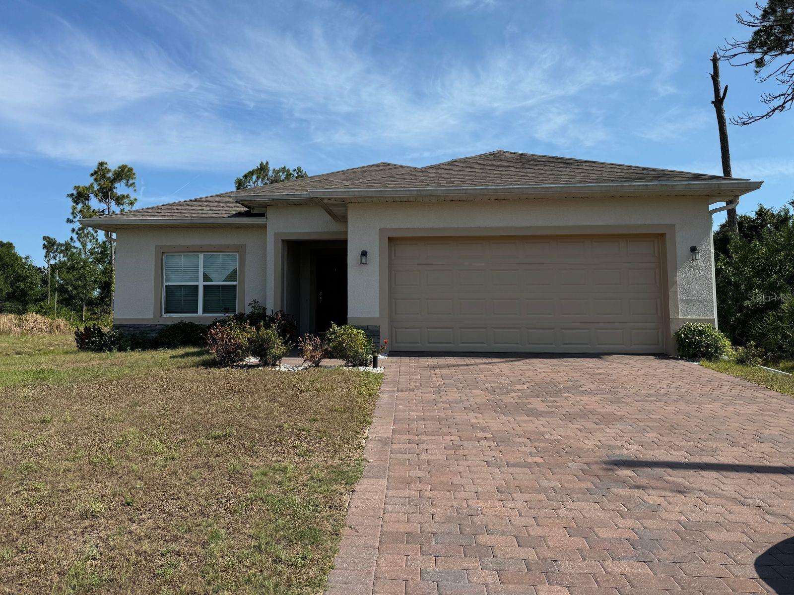 Newer Rotonda West home is now ready for your family.
REDUCED TO 2019 RENTAL RATE! LOW SECURITY DEPOSIT.
This open-concept home is super nice! It has a split bedroom floor plan with tile flooring throughout. From the front door, you enter an entranceway with the den or formal dining room to one side. Moving forward, you see a beautiful open kitchen/living area. The kitchen has this great large kitchen island with granite countertops and stainless steel appliances, including a double-door refrigerator with water/ice from the door. Also, there are upgraded kitchen 42" cabinets and a large pantry. The kitchen is open with the main living area. There are sliders from the living area leading to a screened lanai. Spacious extra room can be used as a home office, media room, or formal dining room. The master is nice-sized with two walk-in closets and two large-sized bedrooms. The primary bath has dual sinks and both baths have granite countertops. Cobblestone driveway leading to the two-car garage plus hurricane shutters are provided. Convenient to shopping and highways. Blinds are provided throughout the entire home. A small pet is okay but must be under 15 pounds with breed approval from the owner.