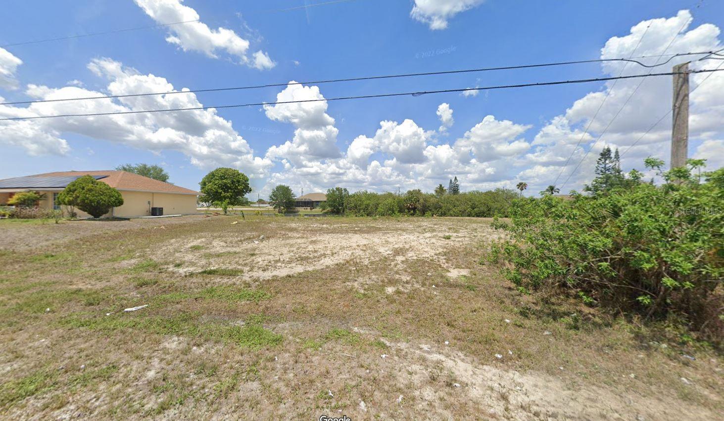 Great opportunity for investors or future residents! Two side-by-side canal-front lots for sale at 335 and 339 NE 19th Terrace, Cape Coral. These freshwater lots feature a seawall and direct boat access—perfect for fishing, kayaking, or relaxing by the water. Ideal for building your dream home or future development. The property includes fruit trees such as longan, sapote, and 10 palm trees. Quiet neighborhood near schools, shopping, main roads, and just 15 minutes from the beach. Buyer to verify all property details.
