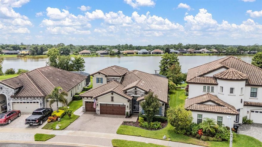 Experience Unmatched Lakefront Luxury in Pristine Lake Preserve!
Welcome to this exceptional LAKE FRONT 4-bedroom, 4-bathroom POOL home with a private office and bonus room, located in the exclusive gated community of Pristine Lake Preserve in Land O’ Lakes. Built by WestBay Homes, this over 3,000 sq ft residence is thoughtfully designed to elevate your lifestyle—combining elegant interior spaces, luxurious outdoor living, and direct access to the tranquil waters of Curve Lake.
From the moment you arrive, the pavered driveway and sidewalk, mature landscaping, and serene lake views set the tone for what awaits inside. Step through the grand entry into a light-filled, open-concept living space with wood-look plank tile flooring, soaring trey ceilings, and custom finishes throughout.
The chef’s kitchen is both beautiful and functional, featuring granite countertops, tile backsplash, top of the line stainless steel appliances, gas range, a large center island and eating space, a built in desk to get your meal planning complete for the week and generous storage. Plantation shutters offer both privacy and style throughout the home.
The primary suite is a serene retreat overlooking the pool and lake, complete with a custom walk-in closet system, separate vanities and a make up desk make getting ready for your day a breeze, a rain shower head, and a spacious walk-in shower. 
Off the main hallway double doors lead to the private office, ideal for working from home with quiet focus.
Bedroom 2 is located at the front of the home and features a built-in closet, plantation shutters, and a full bathroom just outside the room—perfect for guests. Bedroom 3 sits in the mid-section of the home, also with a built-in closet and a full bathroom nearby. Upstairs, you'll find Bedroom 4 along with a generous bonus room and full bathroom—ideal for a media space, playroom, or private guest retreat.
The 3-car garage includes custom built-in shelving, offering exceptional storage and organization.
Step outside and embrace true Florida lakefront living. The backyard is an entertainer’s dream with a natural gas-heated saltwater pool and spa, a custom natural stone waterfall, and a panoramic sunbeam screen enclosure offering unobstructed views of the water. The fully equipped outdoor kitchen features granite countertops, Blaze commercial-grade grill, power burner, refrigerator, and stainless steel drawers.
Enjoy evenings by the custom firepit or walk along over 150 feet of TREX decking, seamlessly connecting the lanai to your covered dock with electricity. The deep-water dock is perfect for boating, paddleboarding, fishing, or simply relaxing lakeside with a sunset view.
This one-of-a-kind home offers the perfect blend of luxury, functionality, and lifestyle in one of Land O’ Lakes’ most exclusive gated lakefront communities. IT'S NOT JUST A HOME...BUT A LIFESTYLE! **BUYER TO RECEIVE $5,000 LENDER CREDIT - ASK AGENT FOR DETAILS