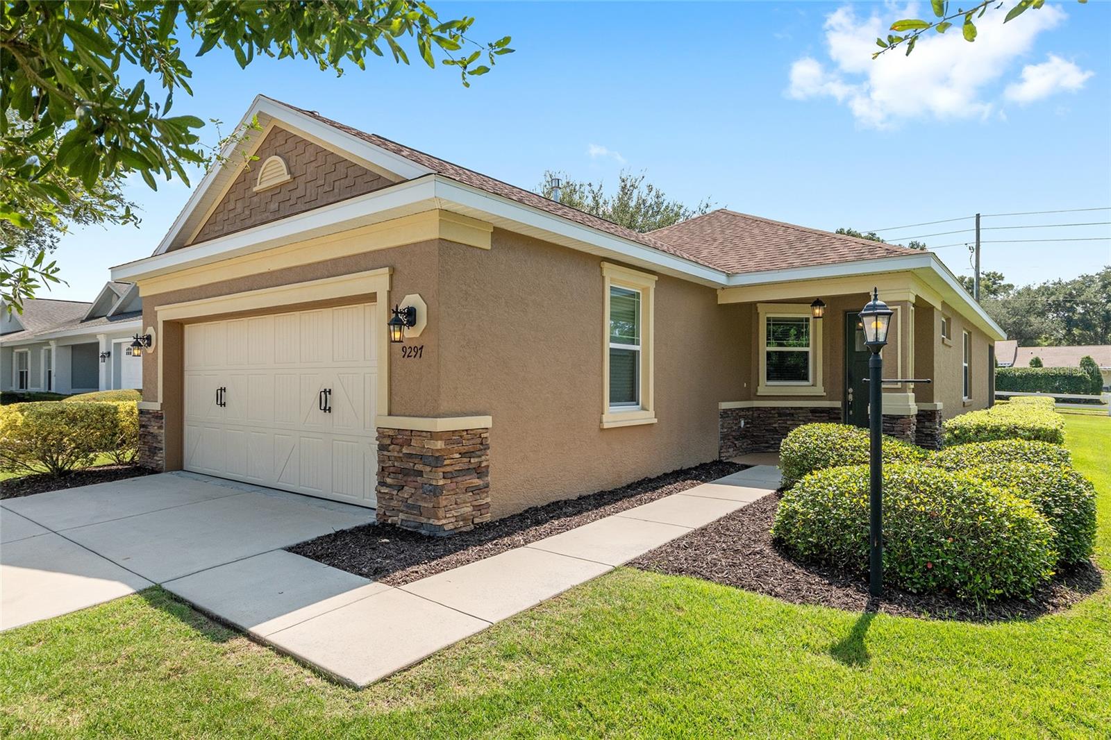 GOLF CART AND FURNITURE INCLUDED!!! All you need is your toothbrush! - This is a beautifully maintained, turn key, Oren model home built in 2017 with a 2 bedroom, 2 bathroom, and a 2 car garage and it is located in the Renaissance Park area of On Top of the World. The home features high ceilings, a beautiful, spacious kitchen with lots of counter space, large pantry; In the master bedroom, a walk-in master closet and quartz counters with double vanity sink in the master bathroom. The stainless-steel gas range, dishwasher, washer, dryer and microwave are all included. Inside laundry room. The golf cart is a 2024 Star Classic, 36 volt, 2 passenger with a bumper to bumper 2 year warranty and 18 month warranty on batteries. Located in Ocala's premier, gated, active 55+ community, loaded with amenities, including golf cart access to two shopping centers.