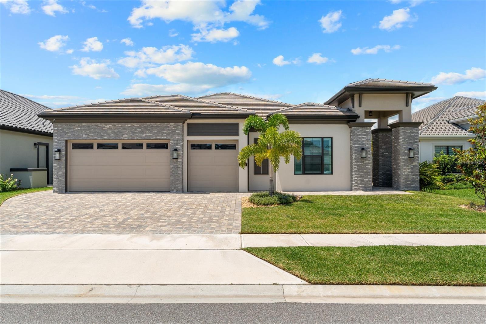 Situated in the prestigious Reeling Park community, this sophisticated 4-bedroom, 3-bath estate with a private office and 3-car garage offers an exceptional blend of elegance and innovation. A paver driveway, tile roof, and full impact glass—windows and sliders—deliver style and security. Inside, designer ceramic tile, 5¼'' crown and base moldings, plantation shutters, and quartz countertops throughout set a refined tone. The Caterer's kitchen is both functional and elegant, featuring 42'' Aristokraft maple cabinetry, stainless appliances, double roll-out shelves, and a Super Susan corner upgrade. A Rinnai tankless water heater, MERV 11 filtration system, and insulated garage doors ensure year-round comfort. Outdoors, enjoy a resort-style pool, summer kitchen, and beautifully finished lanai. Live the Viera lifestyle—golf cart to Addison Village, top schools, shops, and dining, with easy access to beaches, NASA, I-95, and Orlando.