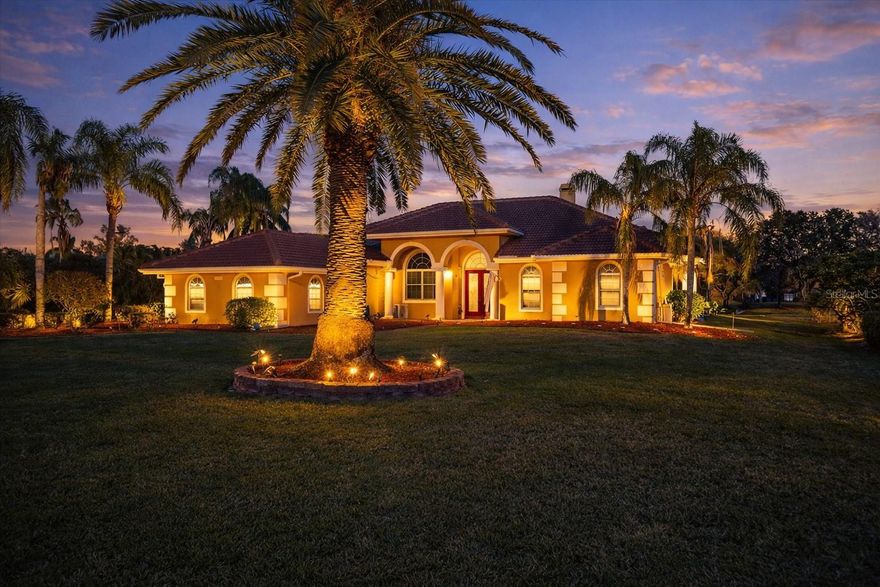 A stunning Peregrine custom built home nestled in the sought-after River Club neighborhood located on the cusp of Lakewood Ranch. Imagine arriving at a residence set back from the road on nearly an acre of land, where your extra-long driveway ushers you into a world of elegance and comfort overlooking the picturesque River Club Golf Course. Step through the impressive double glass front doors into an open floor concept adorned with 12ft and 15ft high ceilings and gleaming marble floors that flow effortlessly into a gourmet kitchen and living space designed for entertaining and comfort. With four spacious bedrooms, three baths, a dedicated den/office, and a huge laundry room complete with a walk-in pantry, every detail has been meticulously maintained. Recent updates include a new barrel tile ROOF (2021) and A/C in 2021, two WATER HEATERS in 2024, POOL HEATER 2023 and modern amenities such as SOLAR landscape lighting and state-of-the-art CCTV monitoring. The home offers a luxurious primary suite with a generous walk-in closet and en suite, while the true 4 CAR GARAGE provides ample space for all your motor toys. Enjoy seamless indoor-outdoor living as sliding doors fully open to reveal a large pool terrace with retractable shades, two covered entertainment areas, and a gas (propane) fireplace perfect for those cozy evenings. Fresh paint inside, no CDD, and a low HOA, this residence combines a refined style with practical functionality, inviting you to experience the very best of Florida living. Minutes away from Lakewood Ranch amenities, SRQ Airport, I75 commuting and Sarasota/Manatee County beaches.