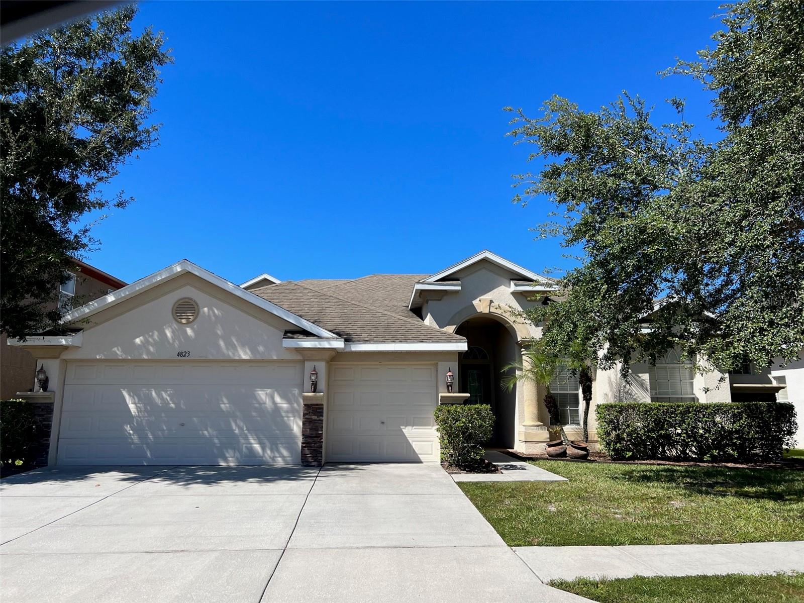 JUST LISTED in COUNTRY WALK! This spacious 5-bedroom, 4-bath home with an office/den plus separate bonus room sits on a breathtaking conservation lot with an oversized backyard. The home features fresh interior paint and new luxury vinyl flooring throughout the first level. Step inside the welcoming foyer and enjoy the open floor plan, designed with plenty of natural light and picturesque backyard views from nearly every room. The layout includes formal living and dining rooms, a comfortable family room, and a breakfast area just off the kitchen. The kitchen is a chef’s delight with Corian countertops, stainless steel appliances, 42" oak cabinetry, and abundant storage space. The master suite offers a true retreat with two walk-in closets, private patio access, and an en-suite bath featuring a garden tub, walk-in shower, and dual vanities. With three sets of sliding glass doors, the home blends indoor and outdoor living seamlessly. Additional highlights include a screened lanai, inside utility room, 3-car garage, irrigation system, and security system, all situated on a quiet cul-de-sac lot. Nestled in the heart of Wesley Chapel, Country Walk offers resort-style amenities including two pools, clubhouse, parks, gazebo, sports fields, aerobics, basketball, and tennis courts.