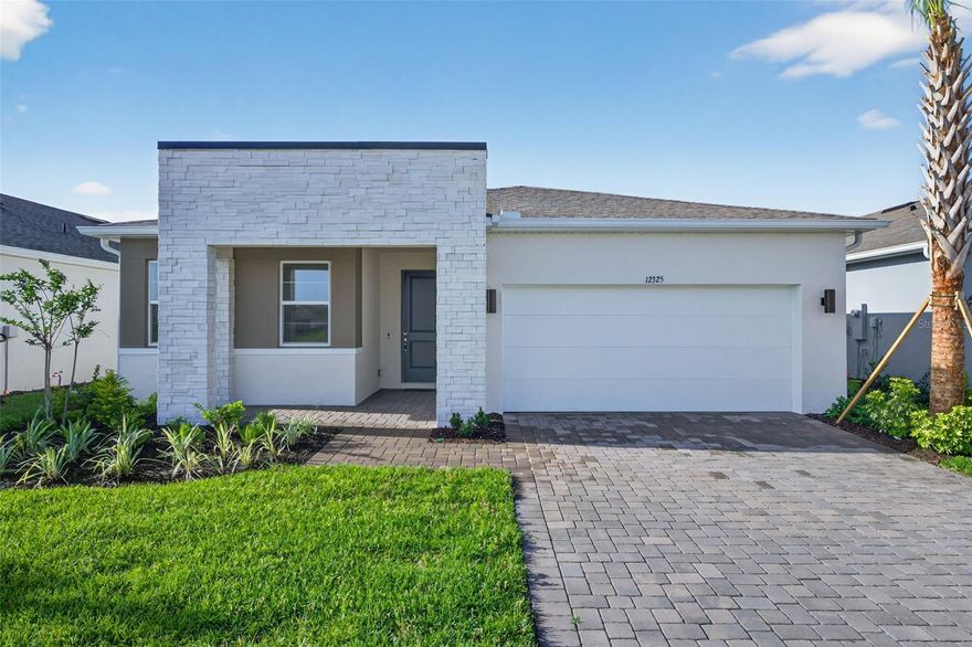 Welcome to the Cascades, a beautifully designed Contemporary exterior style home located in the exclusive gated community of Windwater in Parrish, FL. This exquisite property offers 1,894 square feet of well-appointed living space, featuring 3 bedrooms, flex room, 2 bathrooms, and a 2-car garage.
Upon entering, you will be impressed by the 8' doors, open floor plan and the Coventry Falls oversized 17x17 tile flooring that spans the main living areas, providing both style and durability. The large kitchen is a standout feature, boasting 42" L3 Barnett Maple Rye cabinets  and pristine Frost White quartz countertops, perfect for culinary enthusiasts and entertainers alike. All appliances are included. 
The master suite is a private oasis, offering a spacious bedroom and an en-suite bathroom with dual vanities and a separate shower. The additional bedrooms are well-sized, providing comfort and privacy for family and guests.
Outdoor living is a delight with the covered lanai water home site ideal for hosting gatherings or relaxing. The expansive backyard offers ample space to you to create your own personal retreat.
Windwater is a community known for its tranquil environment and excellent location. Residents enjoy close proximity to schools, beautiful parks, and a variety of shopping and dining options. Additionally, the convenient access to Tampa and Sarasota ensures you are never far from urban amenities and entertainment. Ready Now! Furniture is not included in the sale.