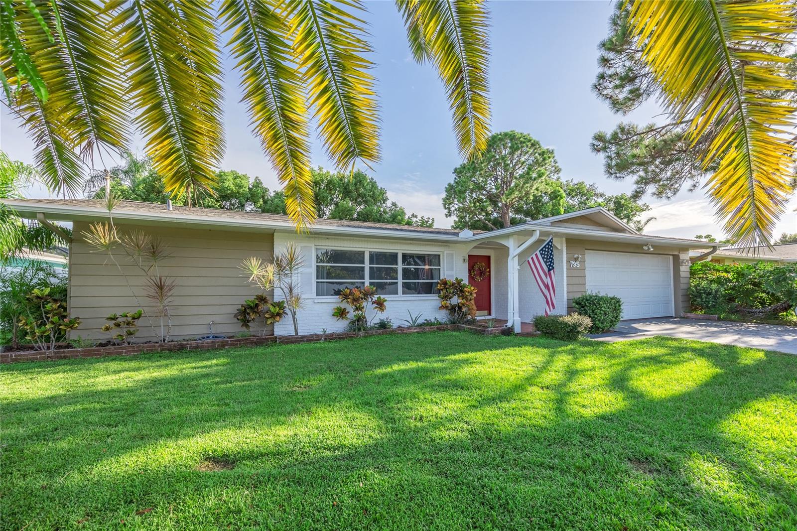 Dunedin beauty boasting 3 bedrroom 2 bathroom 2 car garage with screen enclosed pool and fully fenced yard! Split floor plan with ensuite master bathroom and walk in closet. Newer windows, freshly painted and brand new roof! Sparkling inground pool with screen enclosure and spacious lani for all your entertaining and enjoying outside living! Oversized 2 car garage with laundry hook up and plenty of shelving for storage and vehicles. Located in the heart of Dunedin, walk to shops, the Pinellas Trail or Golf Cart the streets of Dunedin to enjoy the unbeatable Sunsets!