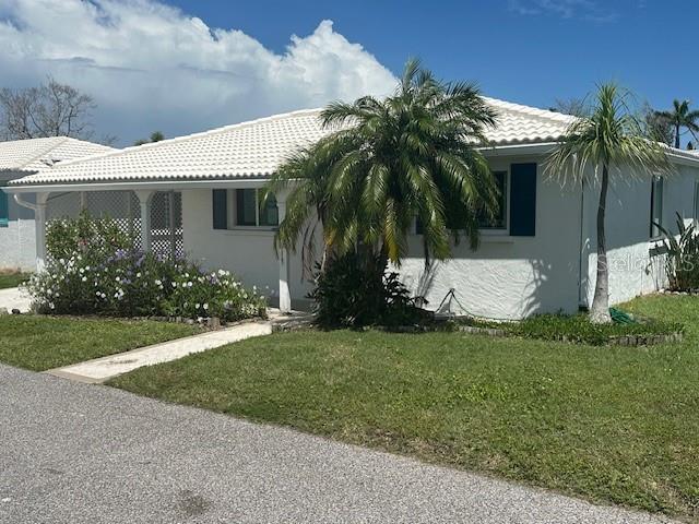 Welcome to Spanish Main Yacht Club, a vibrant 55+ waterfront community on Longboat Key, where coastal living meets unbeatable value. **Offered at just $299,000—including the cost of a complete rebuild—**this stand-alone 2-bedroom, 2-bath villa offers 1,629 total SqFt and represents the best-priced opportunity for a fully restored home in one of the island’s most desirable neighborhoods.
Originally built in 1968, this villa has already undergone major FEMA-approved storm mitigation work, including all-new drywall, upgraded electrical outlets, and a brand-new front entry door. The purchase price includes the cost of finishing the rebuild, so you can move into a beautifully completed home without the hassle of managing renovations.
The open-concept floorplan includes a spacious living and dining area, plus a sunlit Florida room ideal for a reading nook, office, or morning coffee retreat. The generous primary suite features a private bath and closet, while the second bedroom and full bath offer flexibility for guests or hobbies.
Enjoy marina views and the ease of being just a short stroll from the community’s private deeded beach access on the Gulf of Mexico. Spanish Main Yacht Club is rich with amenities, including a heated pool, clubhouse with library and game room, shuffleboard courts, and a full calendar of social events. Boat owners will appreciate the affordable, first-come, first-served slips at the community marina.
This pet-friendly, maintenance-free community offers covered carport parking, ample guest spaces, and beautifully landscaped grounds lined with palms. Ideally located near St. Armands Circle, Anna Maria Island, and Sarasota’s renowned shopping, dining, and white sand beaches, you’ll enjoy the best of Florida living right at your doorstep.
Whether you're seeking a full-time residence, seasonal getaway, or investment, this completely rebuilt villa at $299,000 is a rare find on Longboat Key. The seller is motivated—bring your offer and make this island lifestyle yours today!