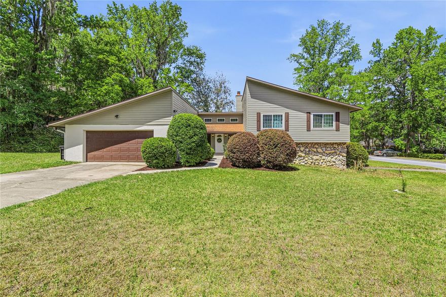 Welcome to this beautifully updated and incredibly versatile home located in the sought-after Hamilton Heights community, just off Newberry Road in the heart of Gainesville. Perfectly positioned on a spacious .38-acre lot, this property offers the ideal combination of comfort, functionality, and flexibility for today’s lifestyle.

The main level of the home features 3 generously sized bedrooms and 2 full bathrooms, thoughtfully laid out to provide both privacy and flow. From the moment you step inside, you’ll notice the extensive updates throughout, including stylish new flooring, modern fixtures, updated appliances, and tastefully remodeled bathrooms. The kitchen is designed with both everyday living and entertaining in mind, offering a cozy eat-in area for casual meals along with a separate dining room that seamlessly connects to the main living space.

The living room is truly the centerpiece of the home, featuring soaring high ceilings that create an open, airy feel, while a centrally located fireplace adds warmth and character. This inviting space is perfect for relaxing evenings or hosting gatherings with family and friends.

One of the standout features of this property is the fully functional lower level, offering approximately 864 square feet of additional living space. Complete with its own kitchenette, living room, full bathroom, and private bedroom, this area is ideal for multi-generational living, accommodating guests, or even creating a potential income-producing rental setup. The flexibility this space provides is a rare find and adds significant value to the home.

Outside, the property continues to impress with a large, fully fenced backyard—perfect for pets, outdoor entertaining, or simply enjoying the Florida sunshine. The expansive lot offers plenty of room to create your own outdoor oasis, whether that’s adding a pool, garden, or play area.

Additional highlights include a spacious 2-car garage, ample storage, and a location that places you just minutes from shopping, dining, schools, and all that Gainesville has to offer.

This home truly checks all the boxes—updated, spacious, and adaptable—making it a must-see for anyone looking for a property that can grow with their needs.