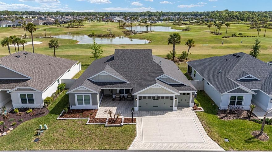 Priced to sell!! Welcome to this beautiful 4 bedroom, 3 bath pre cast concrete and stucco home located in the Village of Newell, offering peaceful water and golf course views. This home features luxury vinyl plank flooring throughout and custom interior paint, creating a warm and inviting feel. The kitchen is nicely appointed with quartz countertops, tile backsplash, stainless steel appliances including a gas range, a breakfast bar, center island, coffee bar, and additional cabinetry for extra storage. The primary suite features tray ceilings and dual walk-in closets, while the primary bath offers dual sinks and a roman shower. All three guest bedrooms include built-in closets, with one guest bath featuring a step-in shower and the other a tub/shower combination. Additional features include ceiling fans in all bedrooms, indoor laundry with a utility sink and extra cabinetry, and sliding glass doors leading to a screened lanai. The painted driveway, walkway, lanai, and garage floor, along with updated landscaping, add to the overall curb appeal. The home also includes a 2 car and golf cart garage and is conveniently located approximately 2 miles to Sawgrass Grove, 1 mile to the dog park, and less than 5 miles to Eastport, providing easy access to shopping, dining, and entertainment.