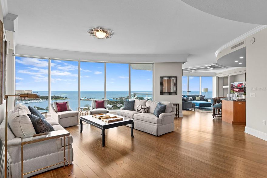 Welcome to the sleek and sophisticated residence of Ovation 1401 in downtown St Petersburg, Florida!  Marvel at sweeping views of Tampa Bay and the iconic St. Pete Pier from the extended unobstructed views through multiple rooms on the Northeast side of the tower. Ascend through a dedicated elevator opening to your private vestibule and 3,660 square feet of comfort and ease, to one of only 45 homes epitomizing a refined living experience.  The gourmet kitchen, showcasing Wolf and Sub-Zero appliances, stands ready for culinary endeavors and family gatherings. The effortless flow of family, living, and dining spaces creates an ideal environment for both intimate gatherings and lively entertainment. Sunlight pours through the floor-to-ceiling windows, accentuating the richness of the hardwood floors and the 10-foot ceilings, creating an inviting and opulent atmosphere. There are spacious closets in the main hallway, specifically designed in this residence for additional storage. Outside, multiple terraces provide views of almost every angle of downtown St Pete. The owner’s suite is a realm of luxury with an en-suite bathroom. It has a glass walk-in shower, a serene soaking tub, and an expansive walk-in closet, adding to the function of this elegant space. Two generously appointed guest suites, each adorned with private terraces, offer expansive retreats that promise a peaceful and welcoming escape for family and friends. A versatile den/office study, complete with custom-built cabinetry, adds a personal touch. This residence also comes with two parking spaces on the third floor with Bluetooth access system, and a climate-controlled storage space. Engage in the Ovation lifestyle, supported by sought-after amenities which include a 24-hour concierge, a full-time onsite property manager, heated pool, spa, saunas, and a putting green. Ovation is situated along the scenic Beach Drive, harmoniously blending privacy with a vibrant downtown lifestyle, just steps away from cafés, museums, shopping, and waterfront parks. Embrace an exceptional living experience at Ovation, where the combination of luxury and serenity is unparalleled. Select 1401 as your seaside gem, capturing each unforgettable moment. Call for your preview today!