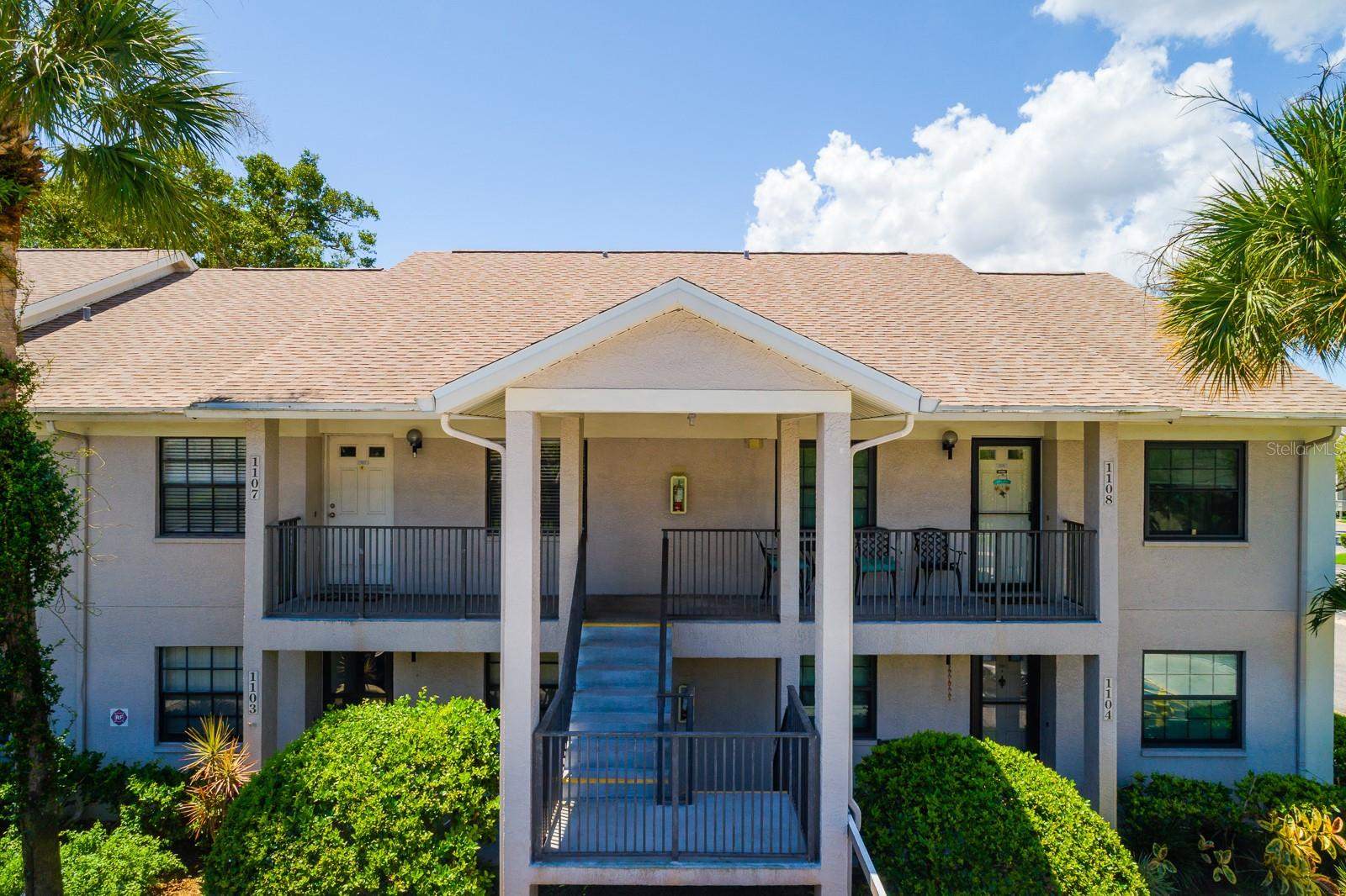 One or more photo(s) has been virtually staged. Discover a peaceful, pond-side escape right in the heart of vibrant Central Dunedin. This beautifully cared-for 2-bedroom, 2-bath condo offers a lifestyle that blends relaxation and accessibility, just minutes from the charm of Downtown Dunedin, boutique shops, local eateries, and an easy commute to Tampa. Perched on the second floor, this light-filled unit welcomes you with soaring vaulted ceilings, an open-concept layout, and calming views that instantly make you feel at home. Step onto the screened lanai, your new favorite coffee spot, overlooking a sparkling pond and fountain that feels like your own private oasis. The in-unit laundry is cleverly tucked away here, so even chores come with a view. Retreat to a serene primary suite featuring pond views, vaulted ceilings, dual closets, and a spacious vanity area leading to a walk-in shower. The guest bedroom offers comfort and flexibility, with a large closet and natural light pouring in from the front window. The community invites you to unwind with a resort-style pool, expansive sun deck, and welcoming clubhouse—perfect for weekend lounging or social gatherings. Assigned covered parking and plentiful guest spots ensure convenience for both you and your visitors. This condo is more than just a home—it’s a lifestyle upgrade, and your move to Dunedin could be easier than ever. Don’t wait—schedule your private showing today and experience it in person!