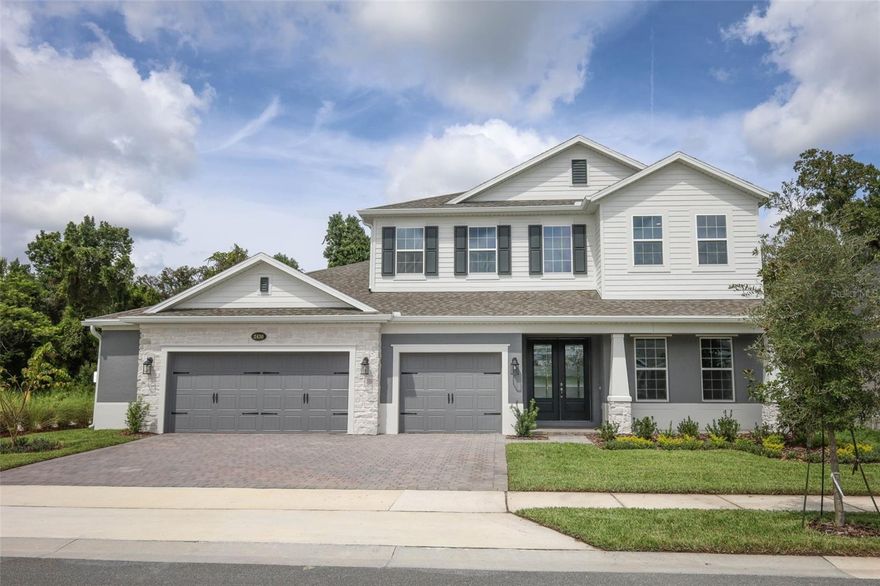One or more photo(s) has been virtually staged. Welcome to Francisco Park, an intimate enclave community in Oviedo known for its charming curving streets, thoughtful landscaping, and unmatched curb appeal. Tucked away on a premium homesite at 2430 Francisco Art Court, this brand-new Tradewinds plan by MI Homes brings the perfect combination of elegance, functionality, and serene views that make every room feel like a retreat.

From the moment you arrive, the stately front exterior makes an impression with its stone accents, inviting front porch, and a pavered drive leading to a spacious 3-car garage. Step inside to find a bright, open-concept design where natural light pours through walls of windows, framing stunning conservation views from nearly every angle.

The heart of the home is the gourmet kitchen, boasting white cabinetry, quartz countertops, stainless steel appliances, a walk-in pantry, and an oversized island with seating that flows seamlessly into the dining and living areas. Whether hosting gatherings or enjoying quiet evenings, this open design offers both comfort and style.

The primary suite on the main floor is a private haven featuring dual walk-in closets and a spa-inspired bath complete with freestanding tub, walk-in shower, and dual vanities—all with tranquil backyard vistas. A guest suite with full bath on the first floor offers convenience and flexibility. Upstairs, the home expands with additional bedrooms, bathrooms, and a spacious game room that opens to a rear balcony, perfect for soaking in treetop views and fresh Florida breezes.

Outdoor living shines here with a covered lanai and fenced backyard that back directly to conservation, offering both privacy and the beauty of nature.

Beyond the home, Francisco Park offers location and lifestyle in one. Families will appreciate access to top rated Seminole County Schools, while everyone will enjoy proximity to Oviedo on the Park, boutique shopping, dining, medical facilities, and easy commutes with quick access to 417 and 434. Outdoor enthusiasts will love the abundance of nearby trails & parks. Schedule your private tour today!