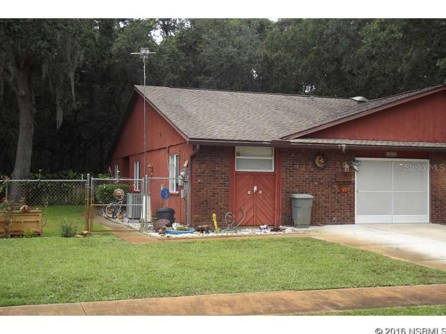 Under contract taking backups. Wonderfully updated 2 BR 2 Bath with 1 car garage. This outstanding floor plan has been thoughtfully updated. A large air conditioned Florida room overlooks the privacy fenced back yard with extra storage shed which backs up to beautiful old growth oaks.  Updates include a newer roof on entire structure, tile floors, updated windows and doors with hurricane protection.  Blown in and reflective insulation in the attic along with a private well to feed the in-ground sprinkler system assuring manageable utility costs.  Closet built ins are in place in all of the closets for extra organization. An additional parking space has been added in the front to maximize vehicle parking. ;Water: City